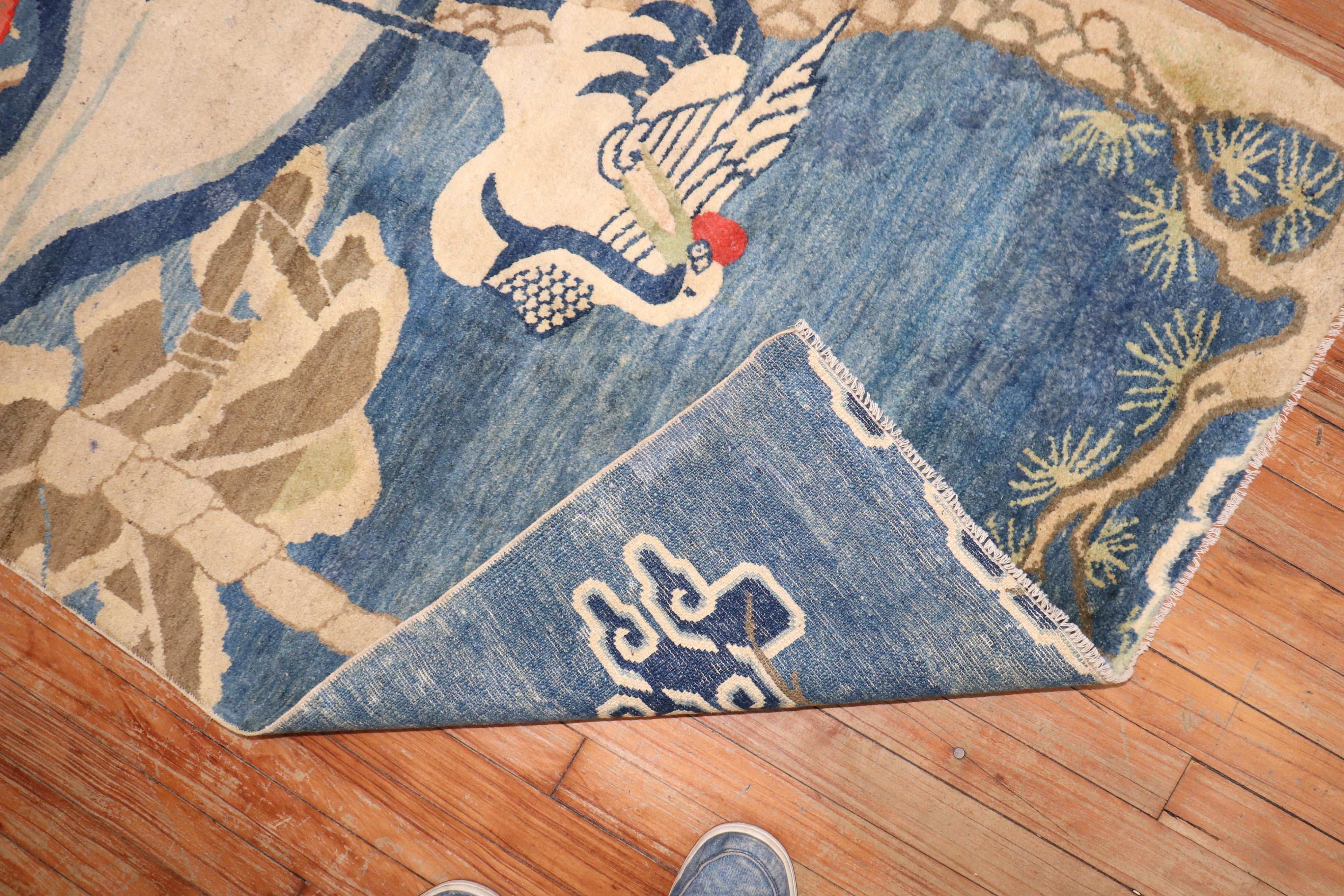 Alfombra tibetana del 2º cuarto del siglo XX con 2 flamencos sobre fondo azul claro

3' x 5'1''

