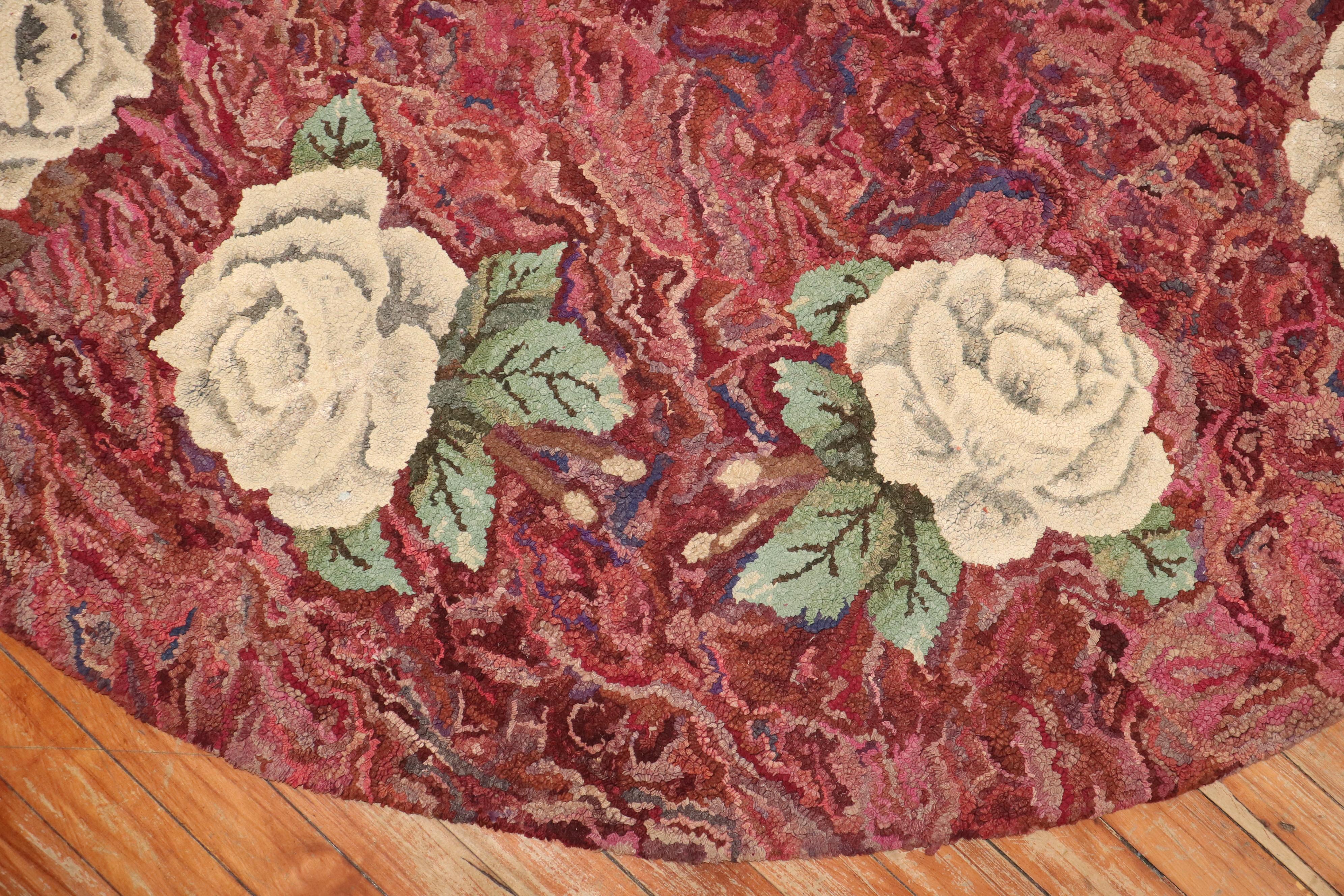 A compelling Mid-20th Century American hooked oval size floral botanical rug

Measures: 6'8