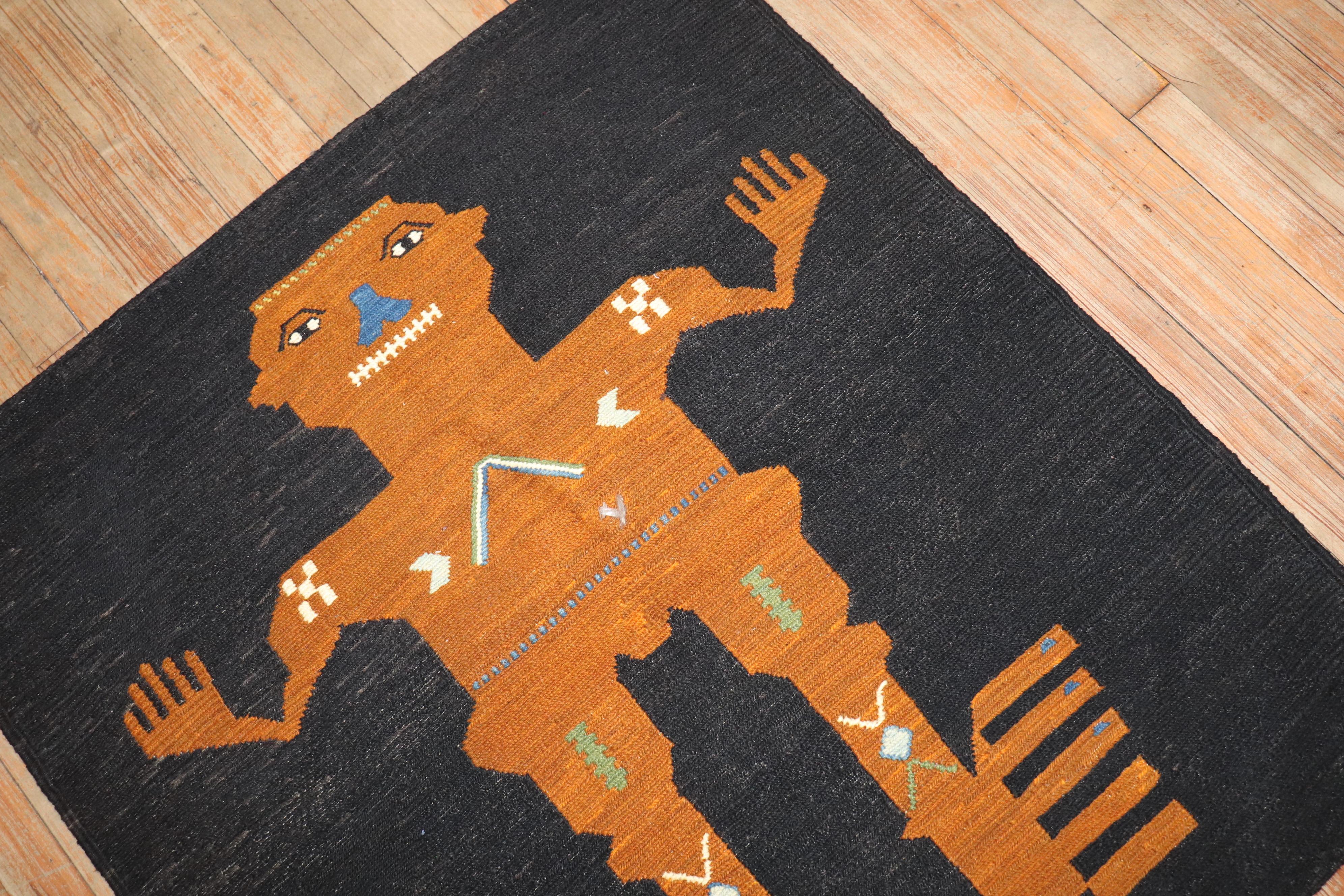 Square scatter-size persian soumac kilim from the late 20th century with a Frankenstein like figure on a dark ground

Measures: 3'2'' x 3'6''.

This was originally belonging to a private Persian collector who requested to make a custom collection of
