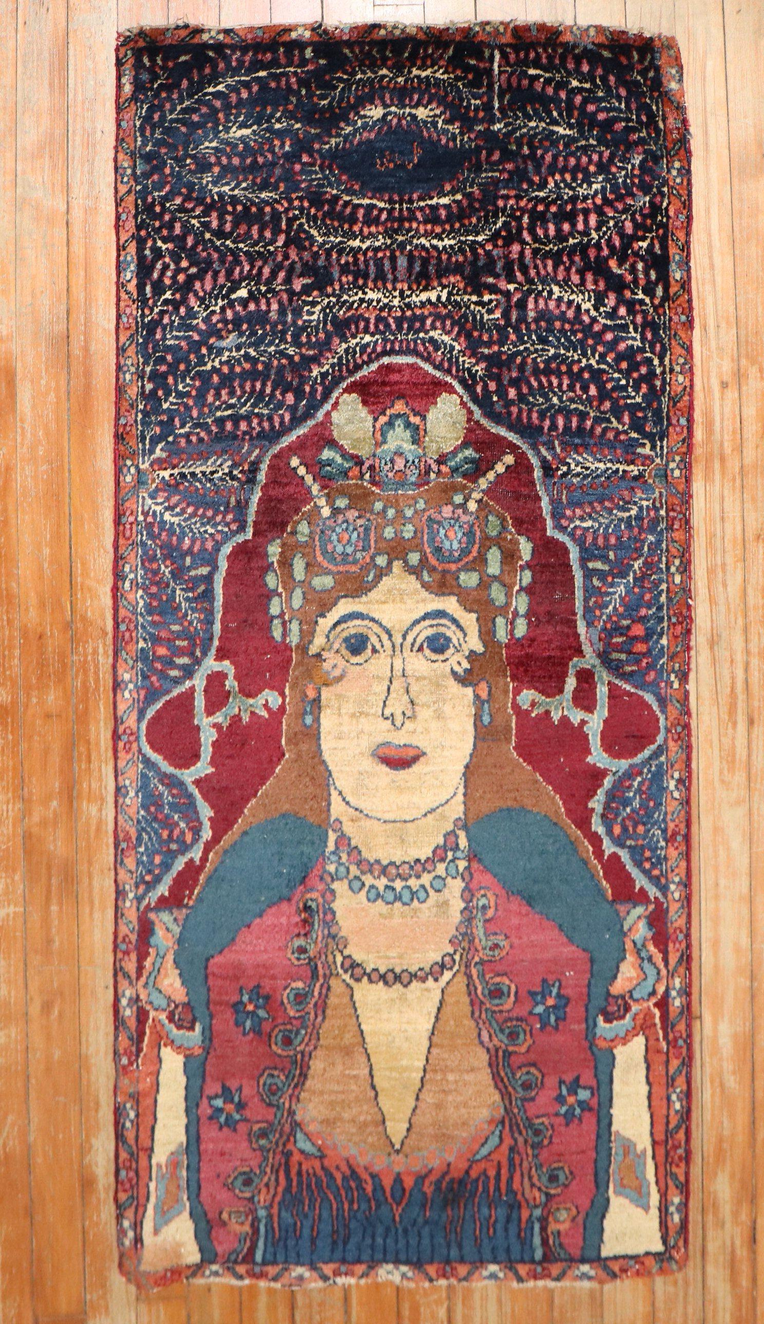 An early 20th century Persian pictorial rug what looks to be some sort of goddess queen

Measures: 2'1'' x 4'3''