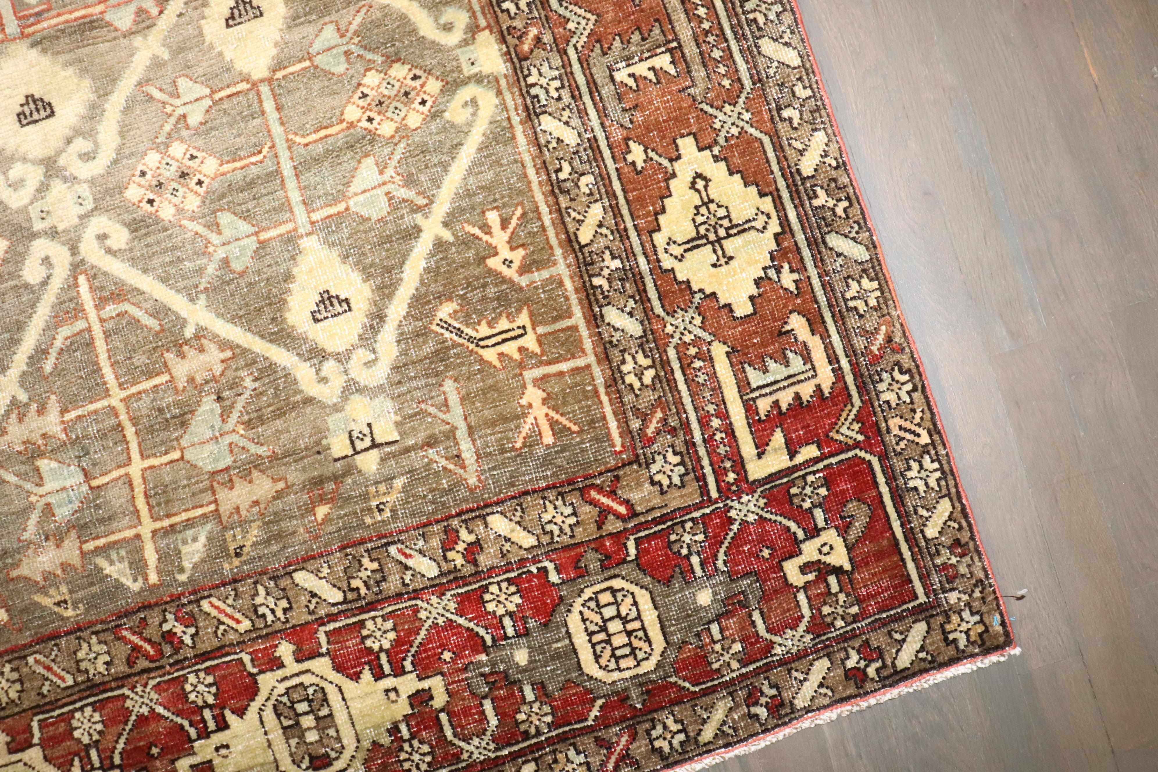 Zabihi Collection Green Brown Masculine Antique 20th Century Persian Heriz Rug In Good Condition For Sale In New York, NY