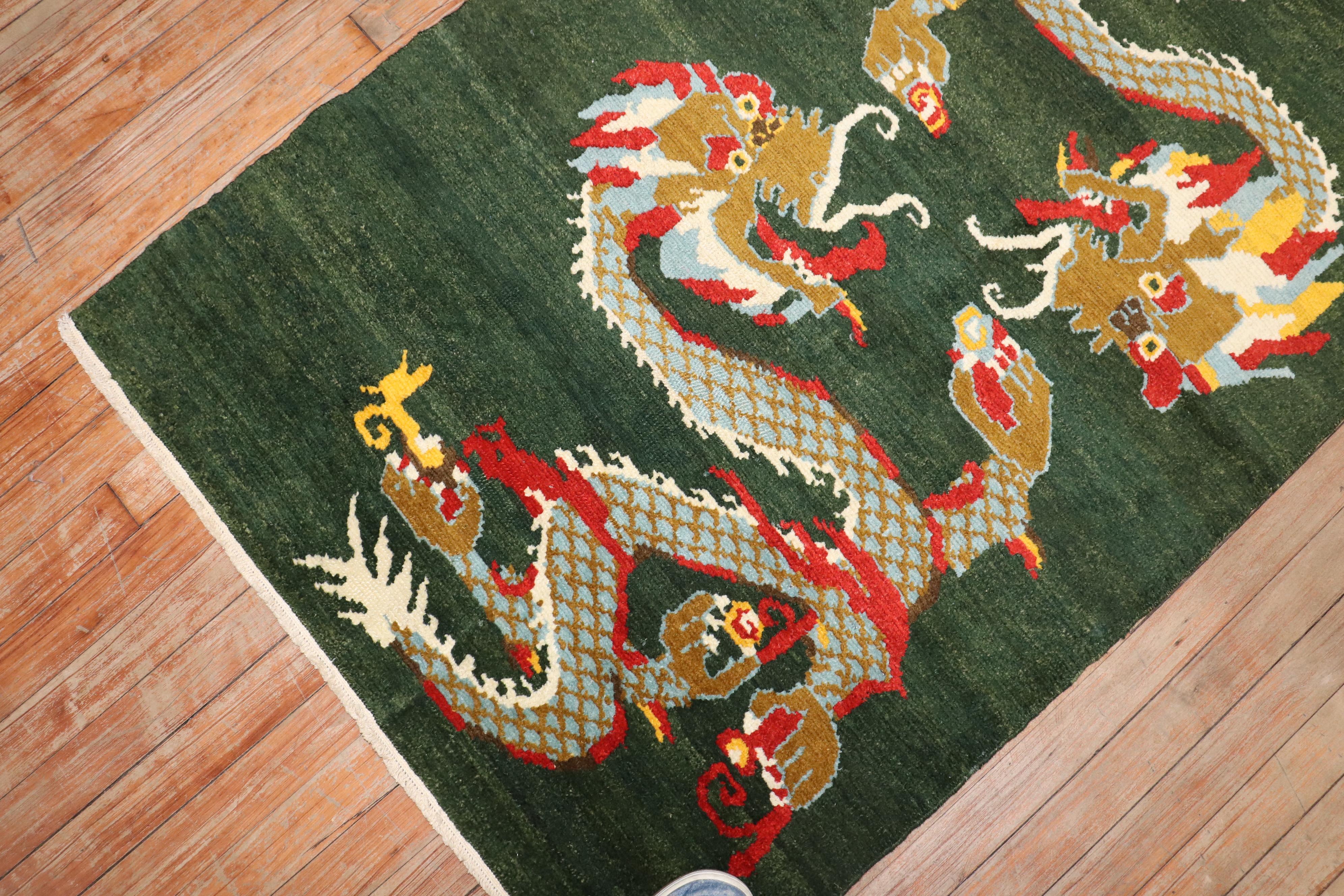 a 3rd quarter of the 20th Century Green Tibetan Pictorial Dragon motif rug

Details
rug no.	j3675
size	3' x 5' (91 x 152 cm)
