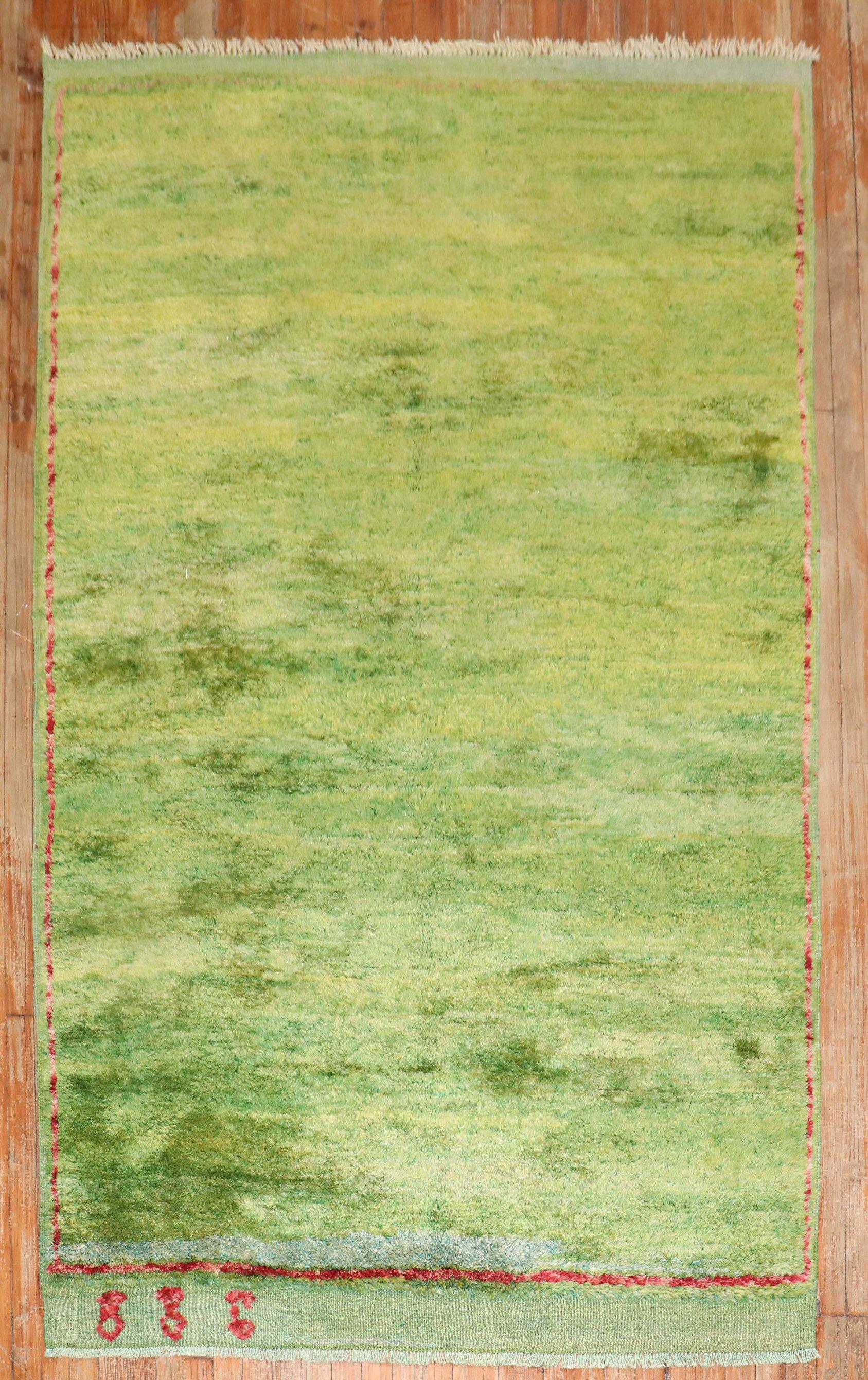 a 3rd quarter of the 20th century one of a kind Turkish Tulu one of a kind rug in predominantly green.

5' x 8'2''

Tulus have been woven in the city of Konya, located in Turkey for centuries, where they were first used as blankets or sleeping