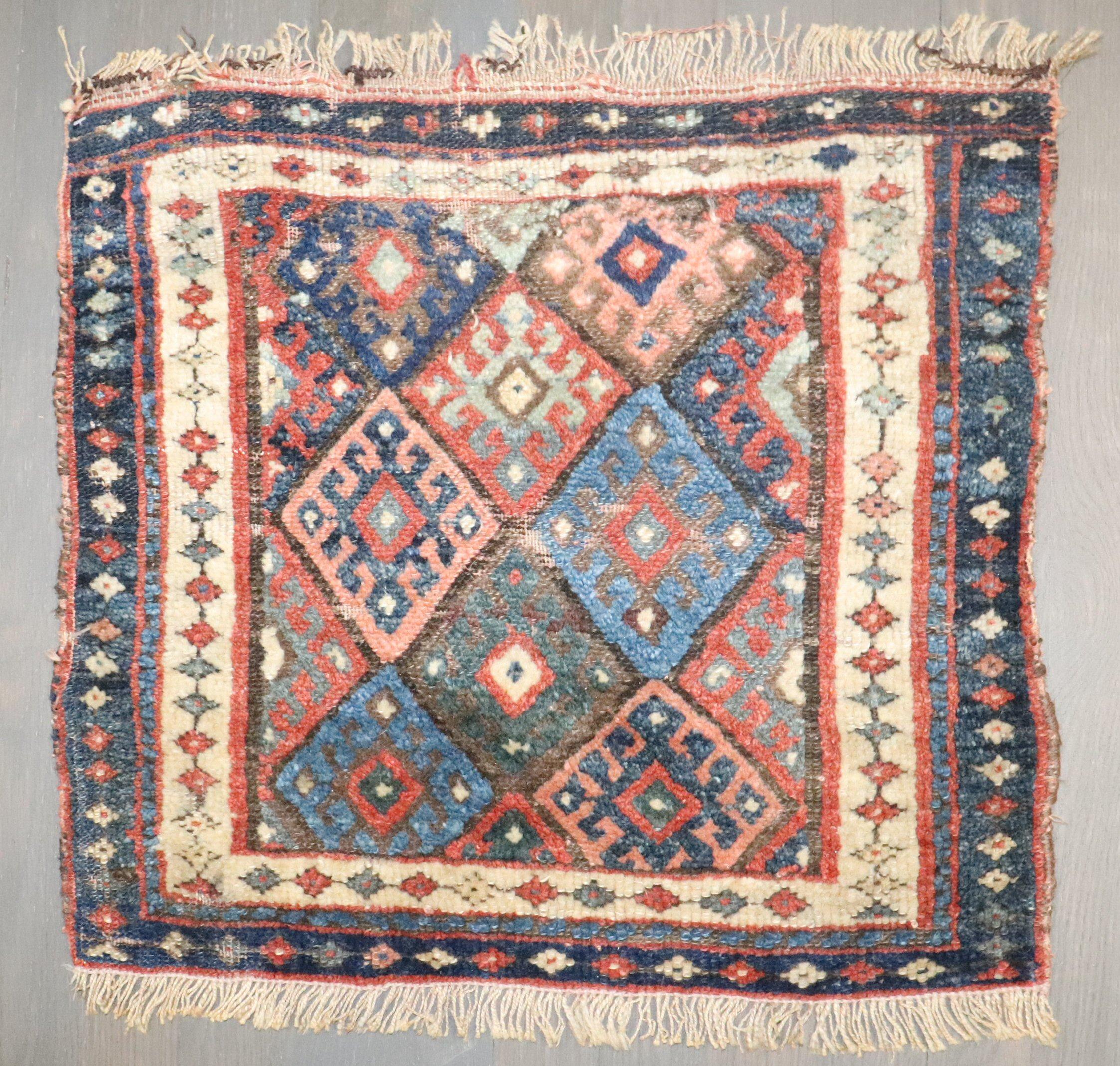 An early 20th-century colorful Jaff Kurd Bagface.

1'8'' x 1'9''