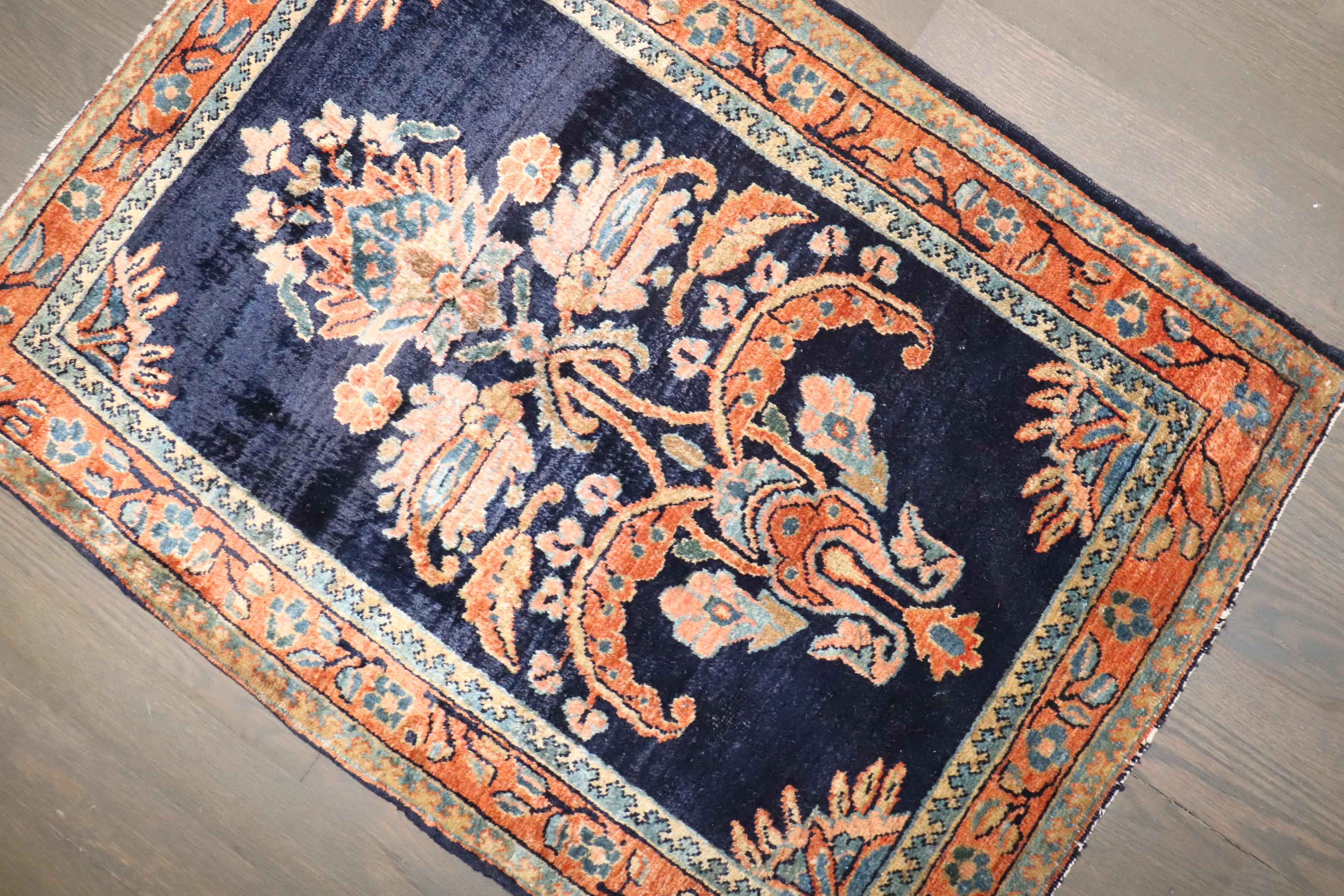 An authentic early 20th-century Sarouk carpet with a traditional formal design 

Measures: 1'10