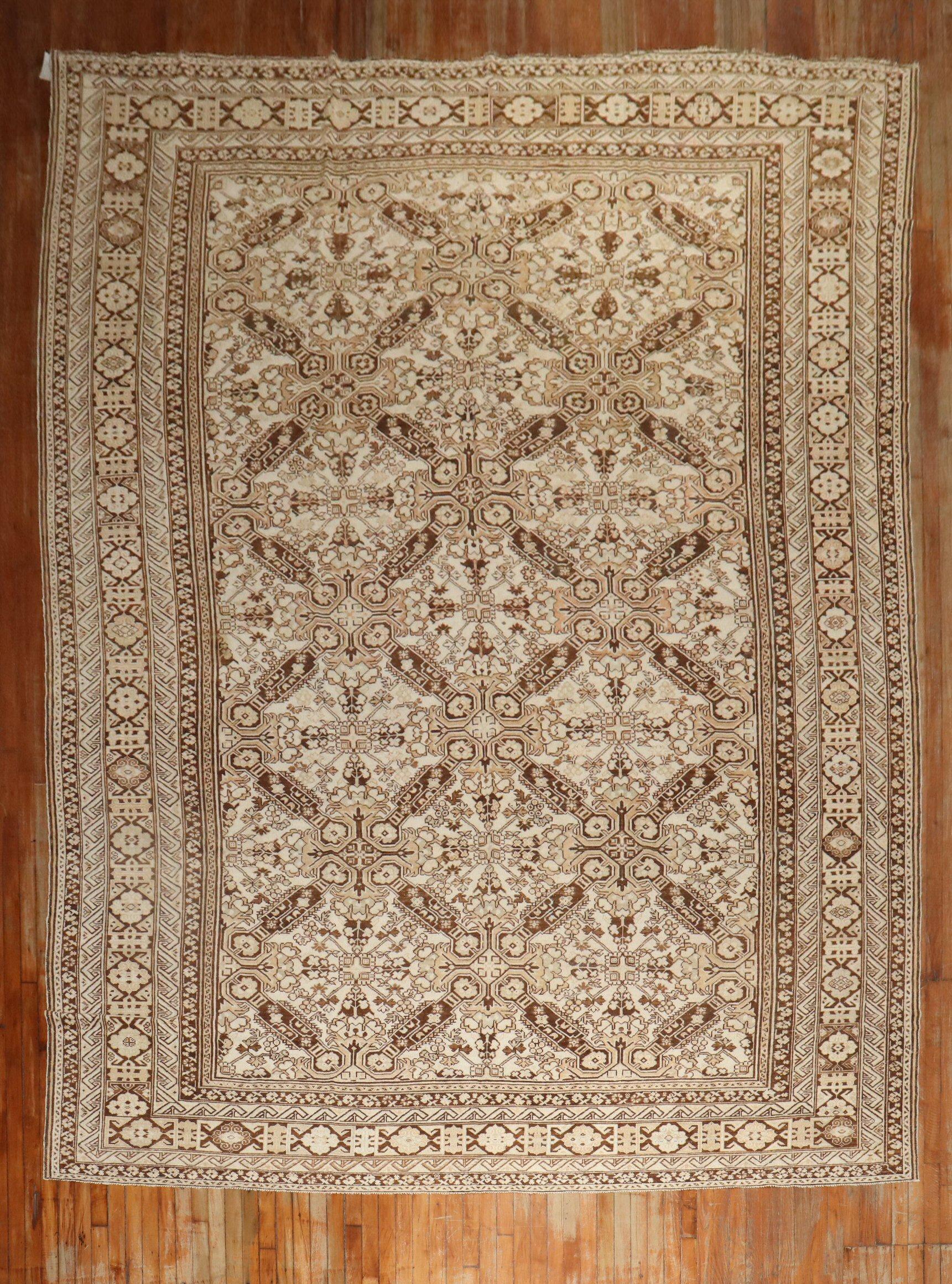 early 20th Kurd rug in ivory, brown and peach tones with a keyhole design you sometimes find in smaller tribal caucasian rug

Details
rug no.	j2579
size	10' x 14' 9