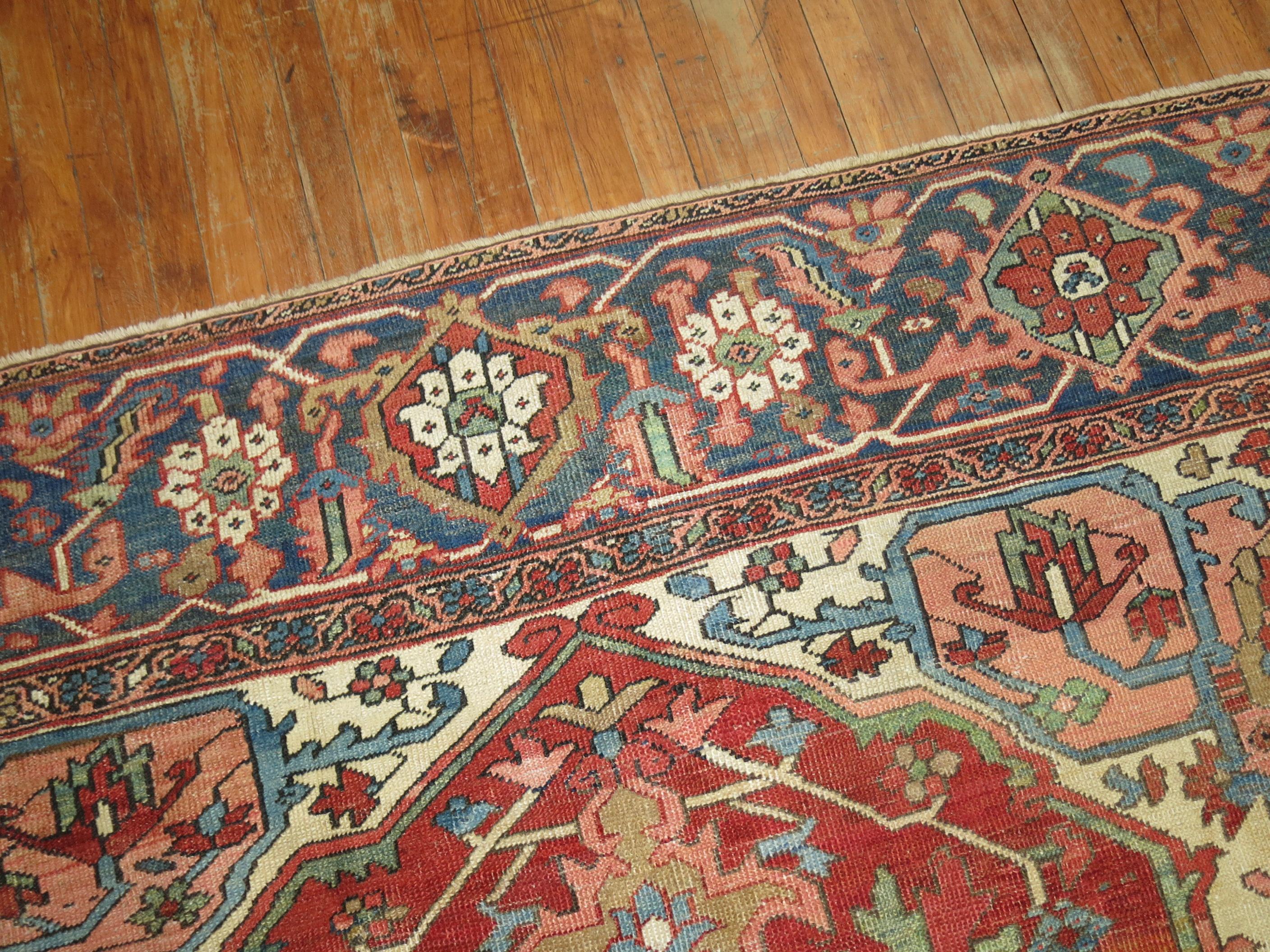 An early 20th-century square shape Persian heriz rug. The medallion is off-centered which looked to be intentionally done by the weaver.

Measures: 8'6'' x 9'2