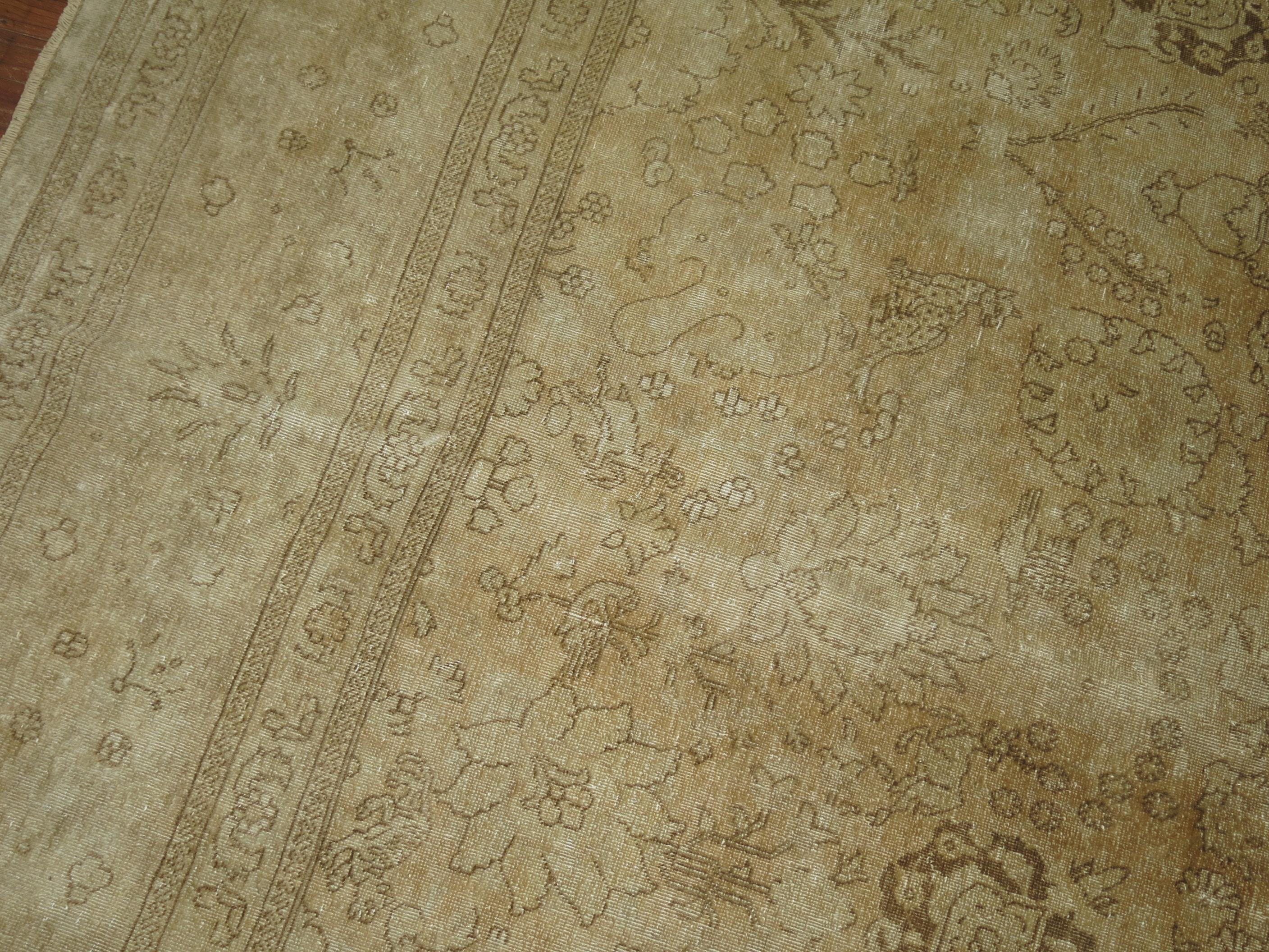 A 2nd quarter of the century Persian Tabriz with a faded pale design throughout 

Measures: 11'2'' x 14'3''.
