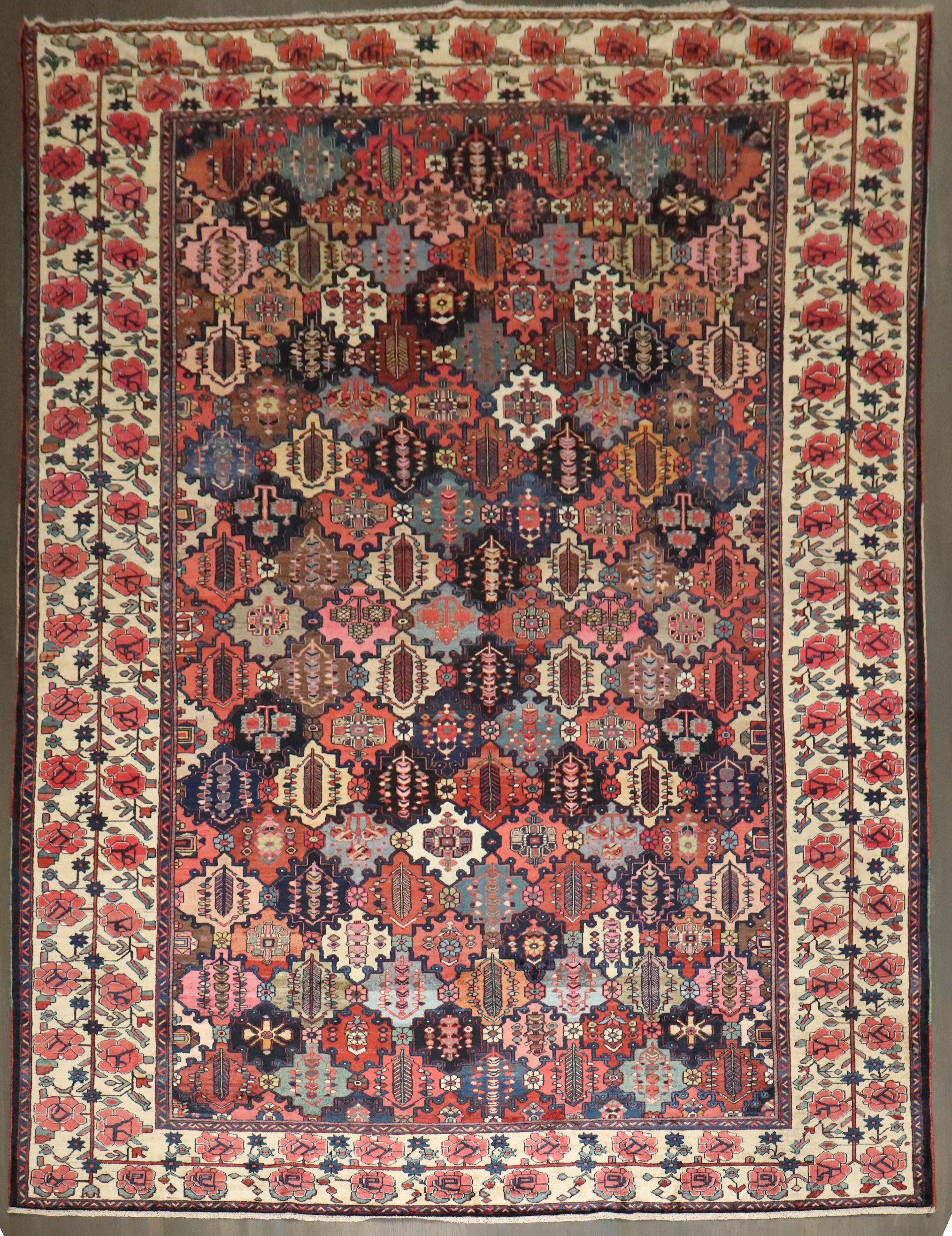 1920s Persian Bakhtiari Rug with an all-over colorful geometric design surrounded by a floral border

Details
rug no.	j4187
size	11' 9