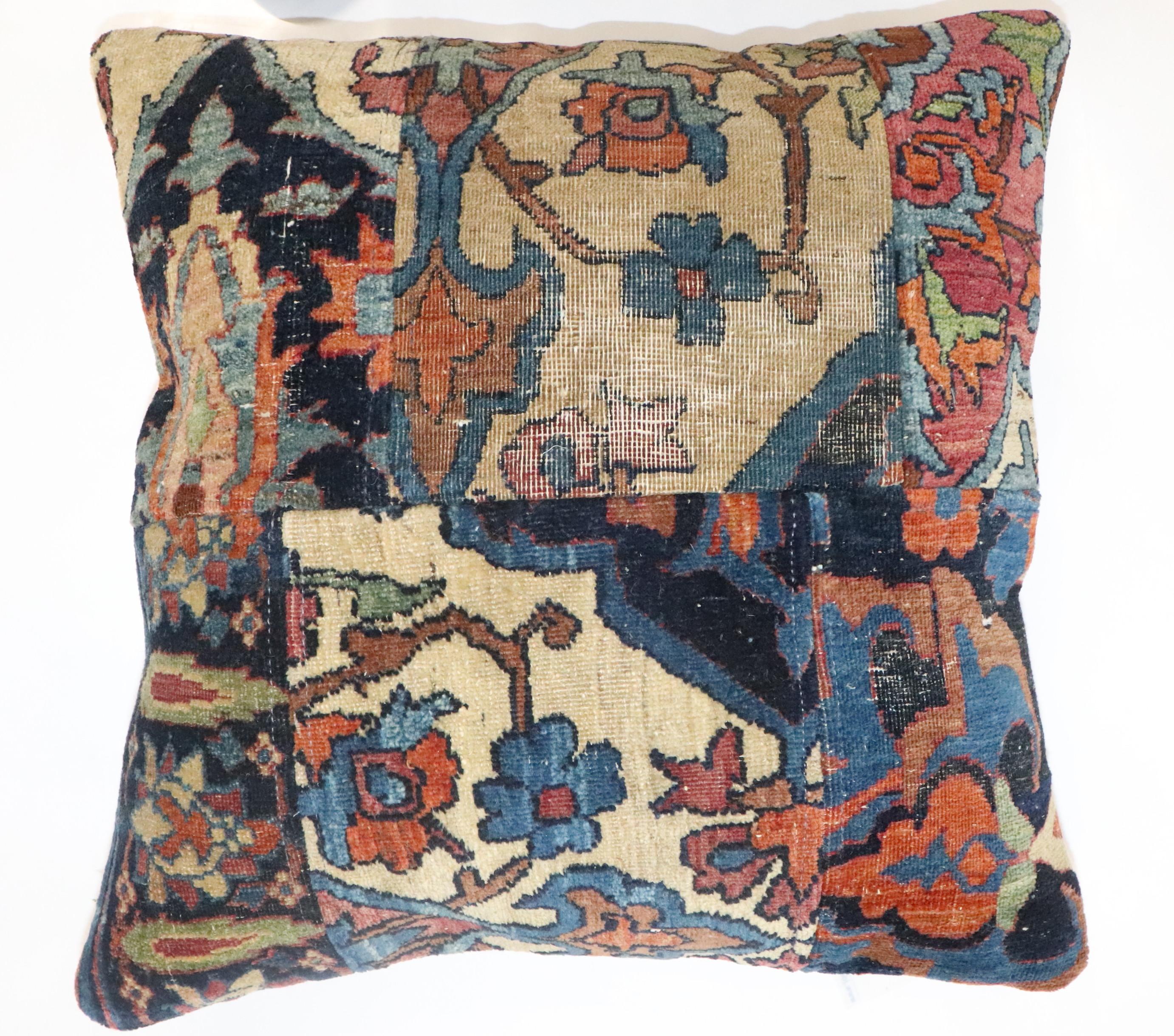 Pillow made from a 19th-century Lavar Persian Kerman rug made into a patchwork format. Fill insert and zipper closure provided

Measures: 18