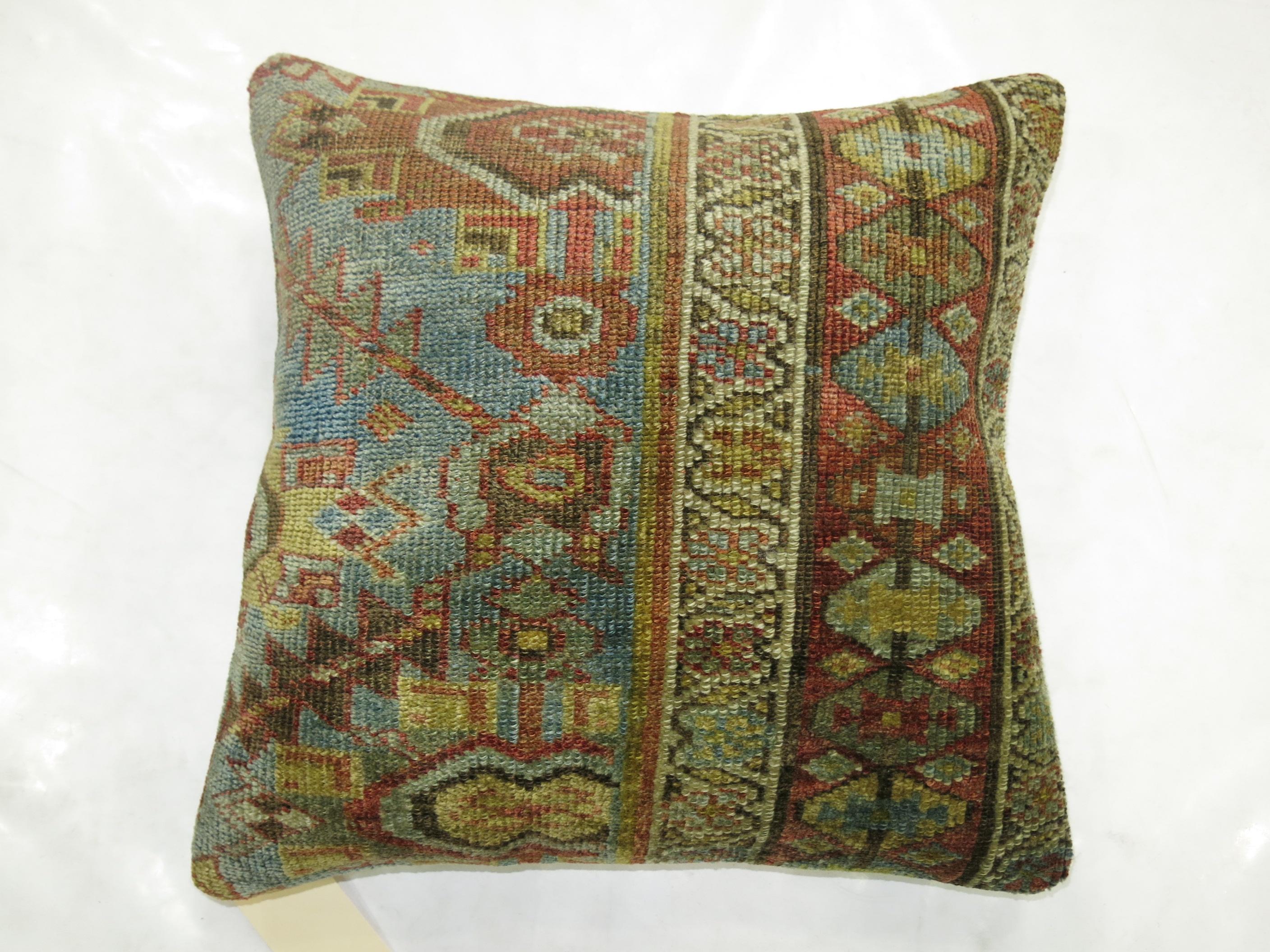 Pillow made from a Persian Malayer rug in dominant light blue and rust accents.

Measures: 19