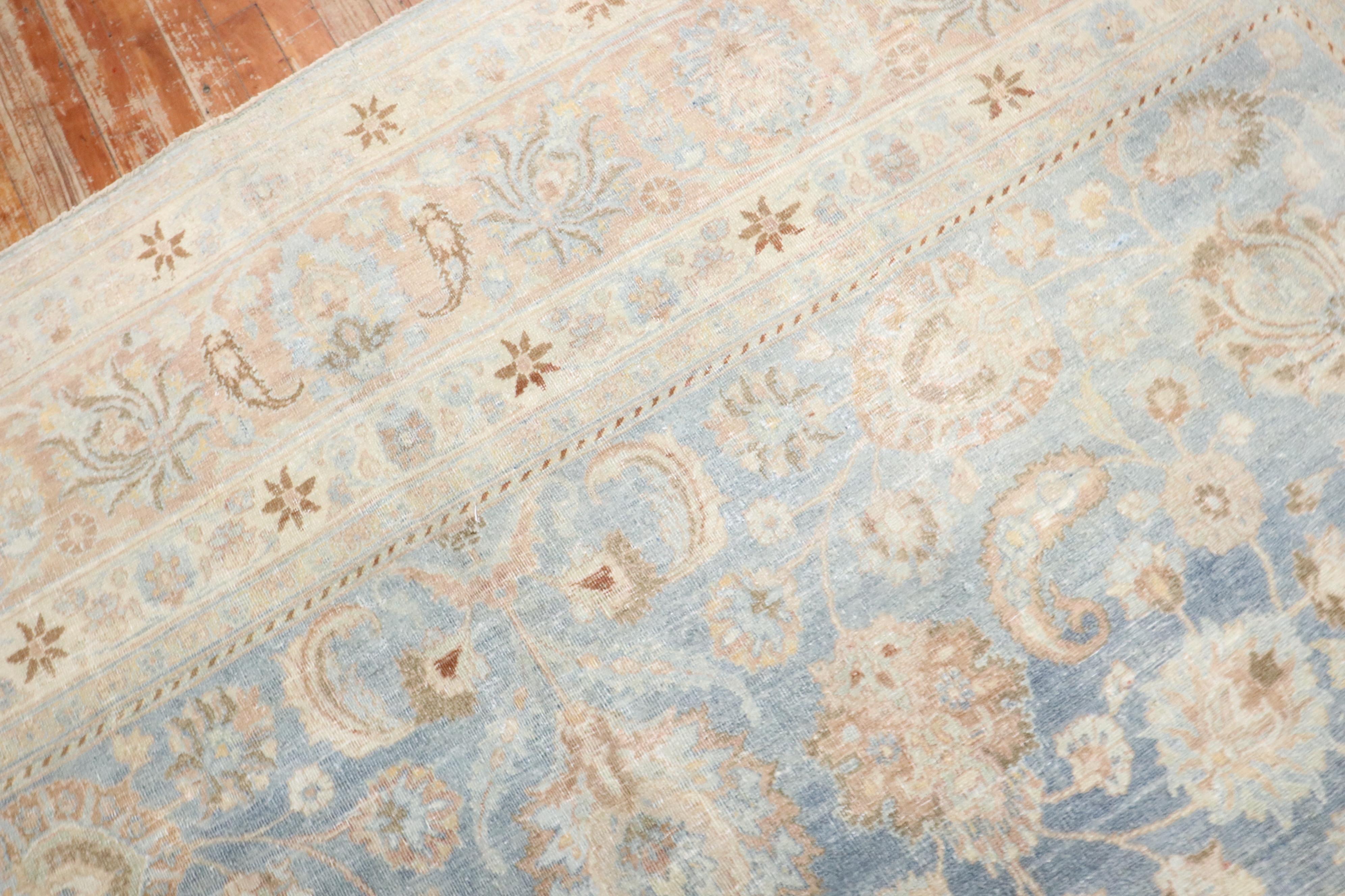 An early 20th century room-size Persian Meshed rug with an all-over formal design on a light blue field

Measures: 10'1'' x 12'11''

The city of Meshed is one of Iran's oldest cities, located in the Khorassan province in the northeast corner of