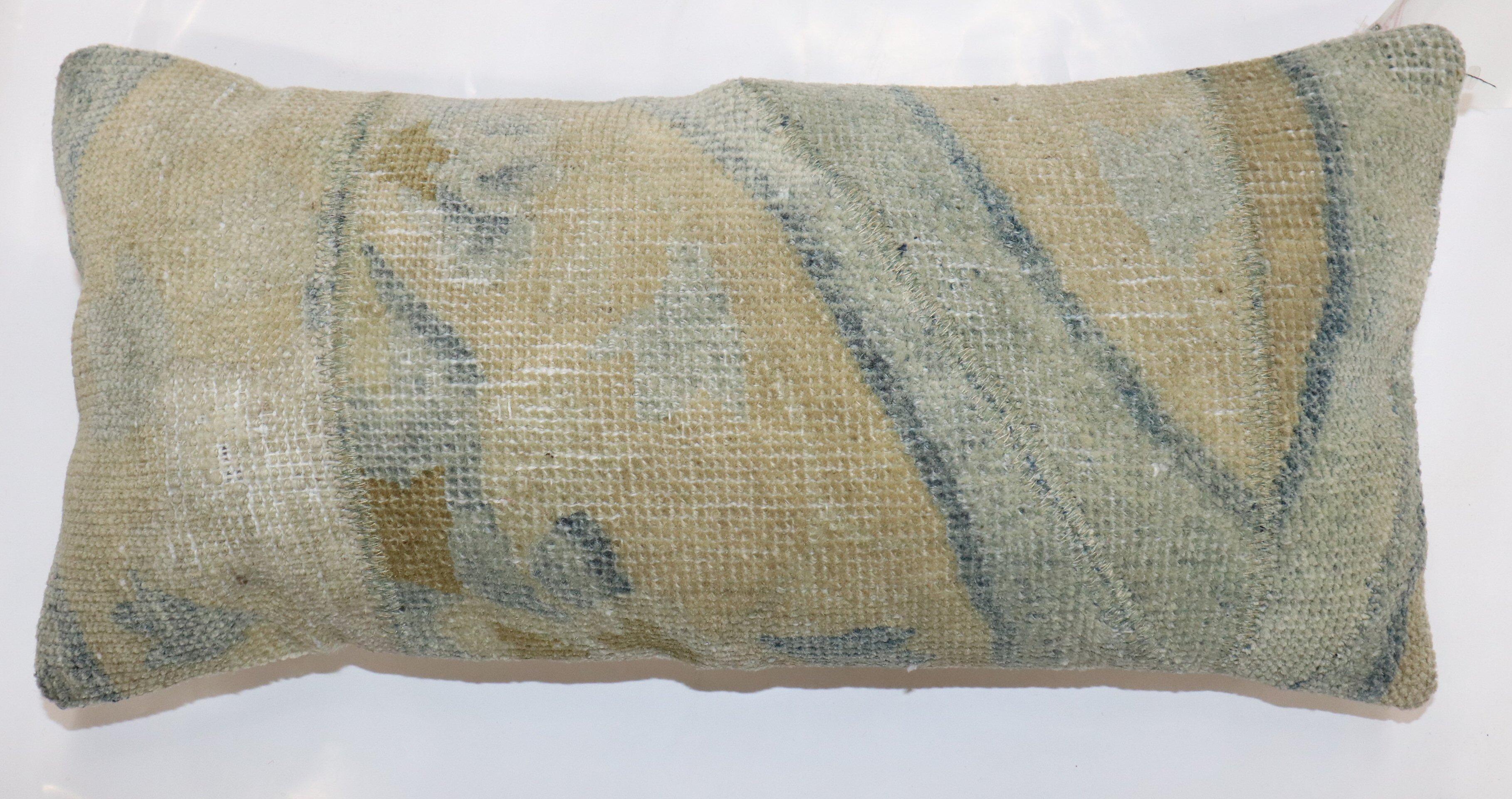 Bolster size Pillow made from a antique chinese rug

Measures: 9