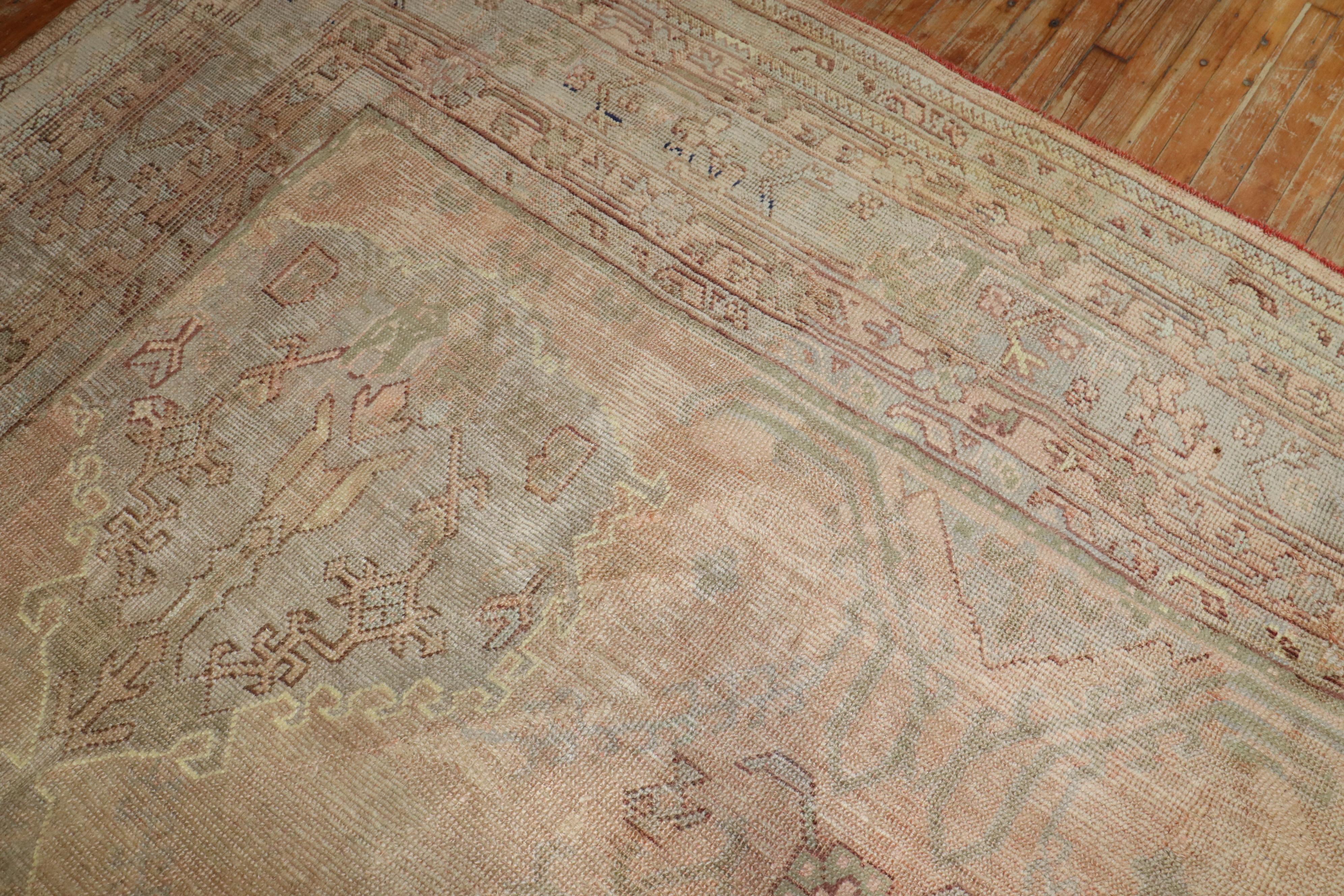 20th Century Zabihi Collection Muted Antique Turkish Oushak Rug For Sale
