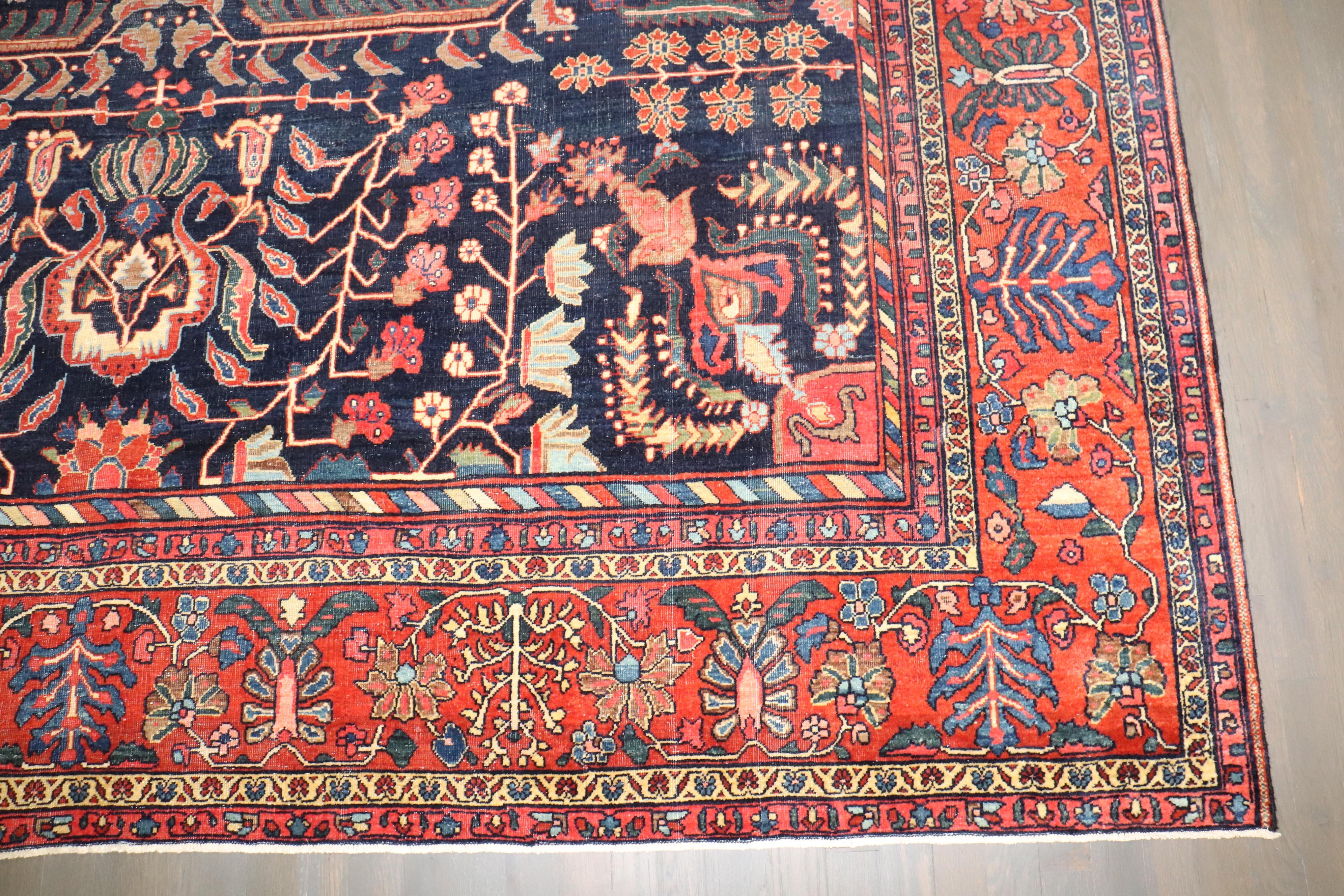 Zabihi Collection Navy Blue Field Antique Persian Fine Sarouk Rug In Good Condition For Sale In New York, NY