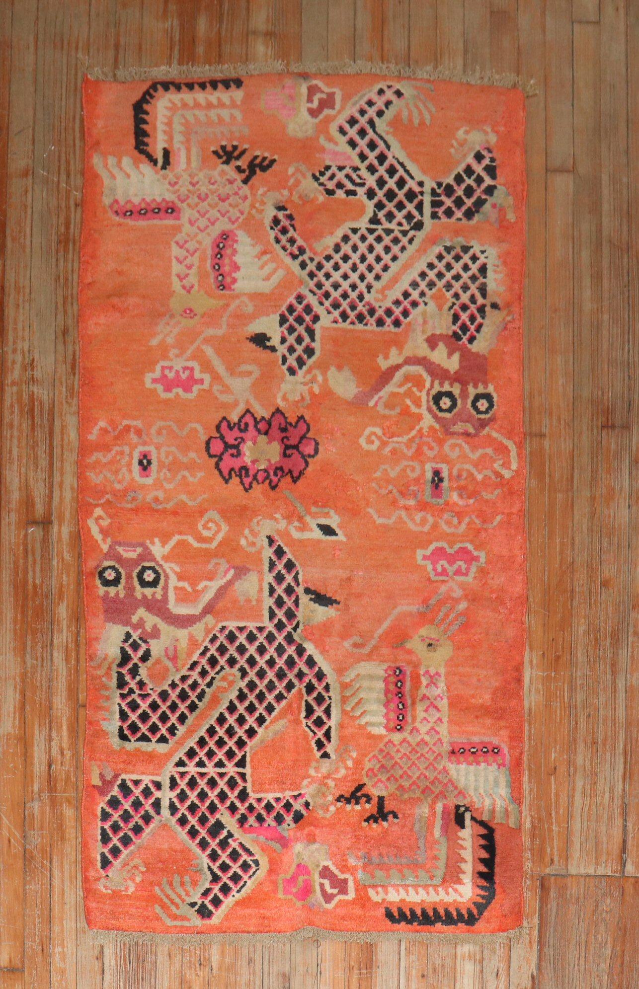 Colorful one-of-a-kind Tibetan rug from the 2nd quarter of the 20th century with a dragon motif on a bright orange field

Measures: 3'1'' x 5'9''.