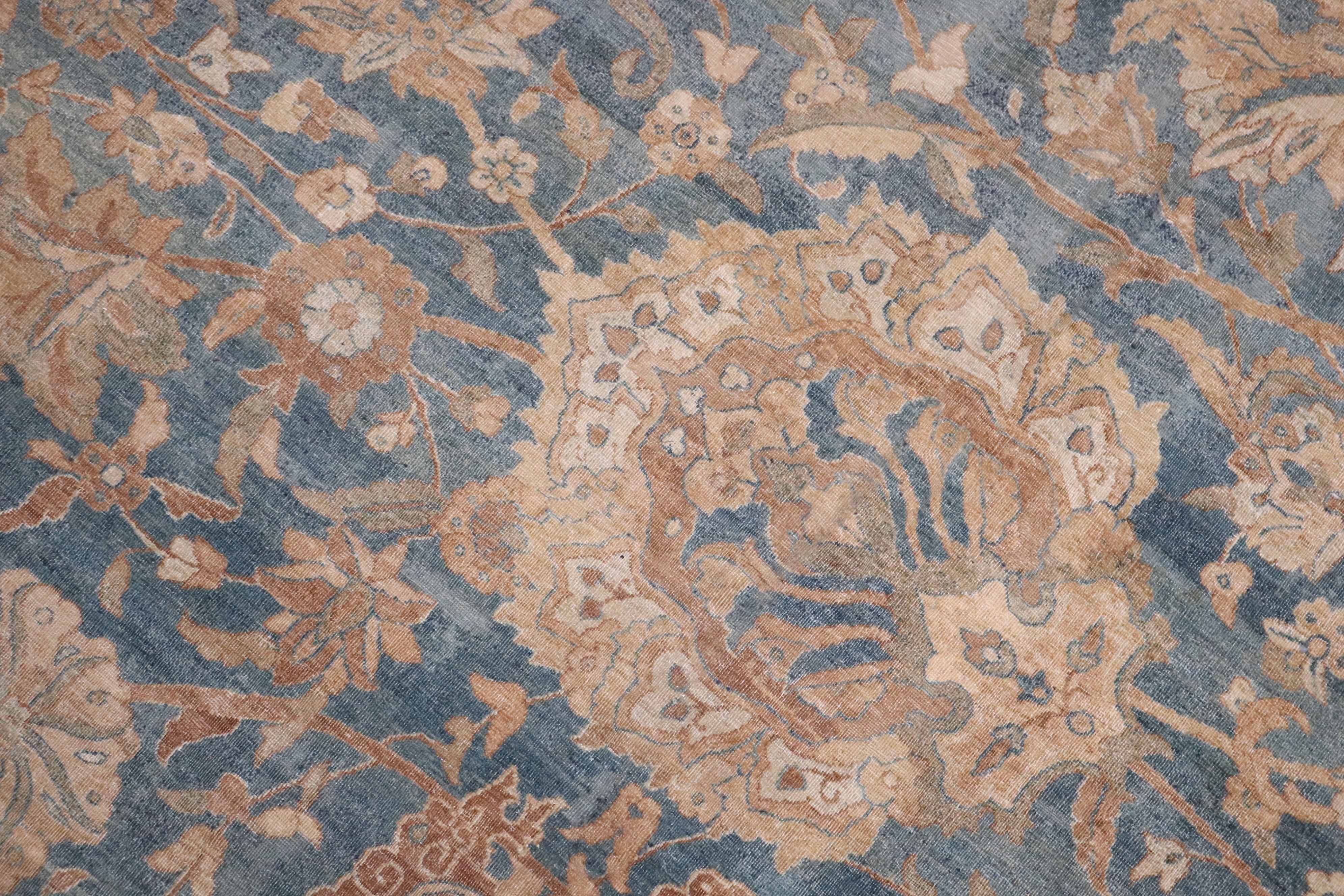 A stunning Late 19th century Persian Tabriz Rug in predominantly blues, with accents in cream and khaki

Details
rug no.	10797
size	14' 1