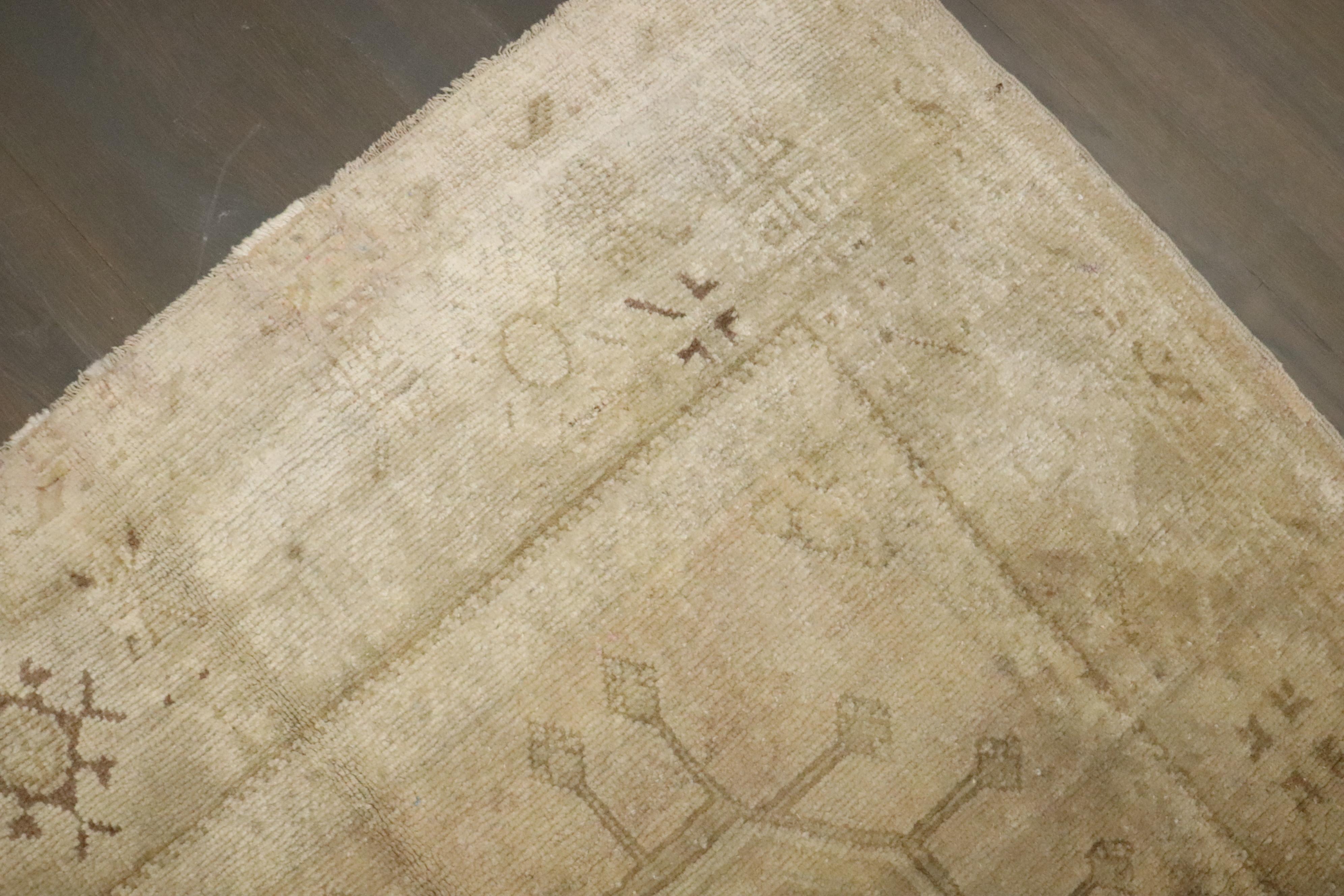 A vintage Turkish oushak neutral color gallery rug 

Measures: 4'8'' x 12'4''.