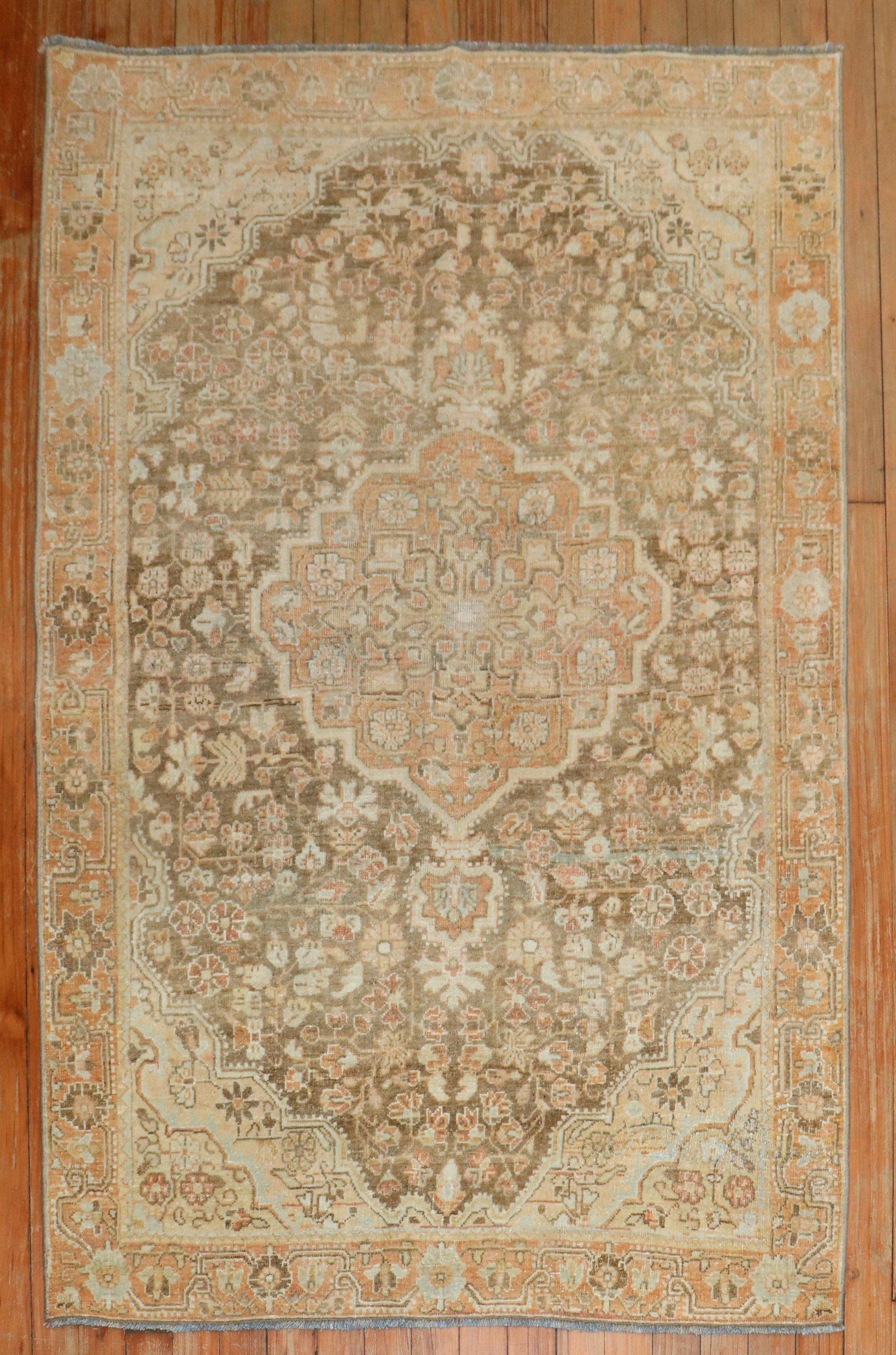 An early 20th century Persian Jozan sarouk in soft brown and orange.

3'3'' x 4'9''

.