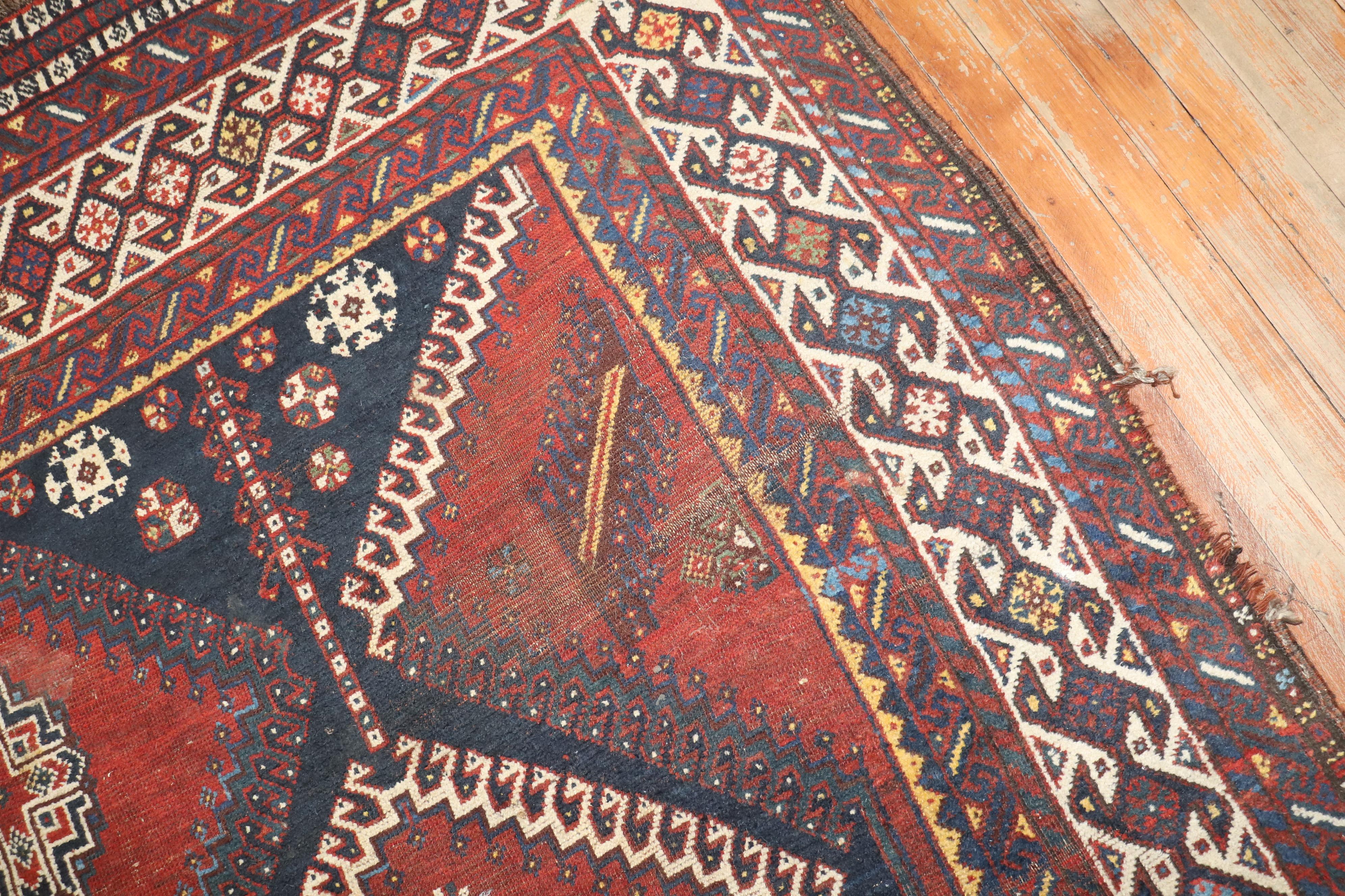 Rustic Zabihi Collection Persian Shiraz Worn Tribal Gallery Rug For Sale