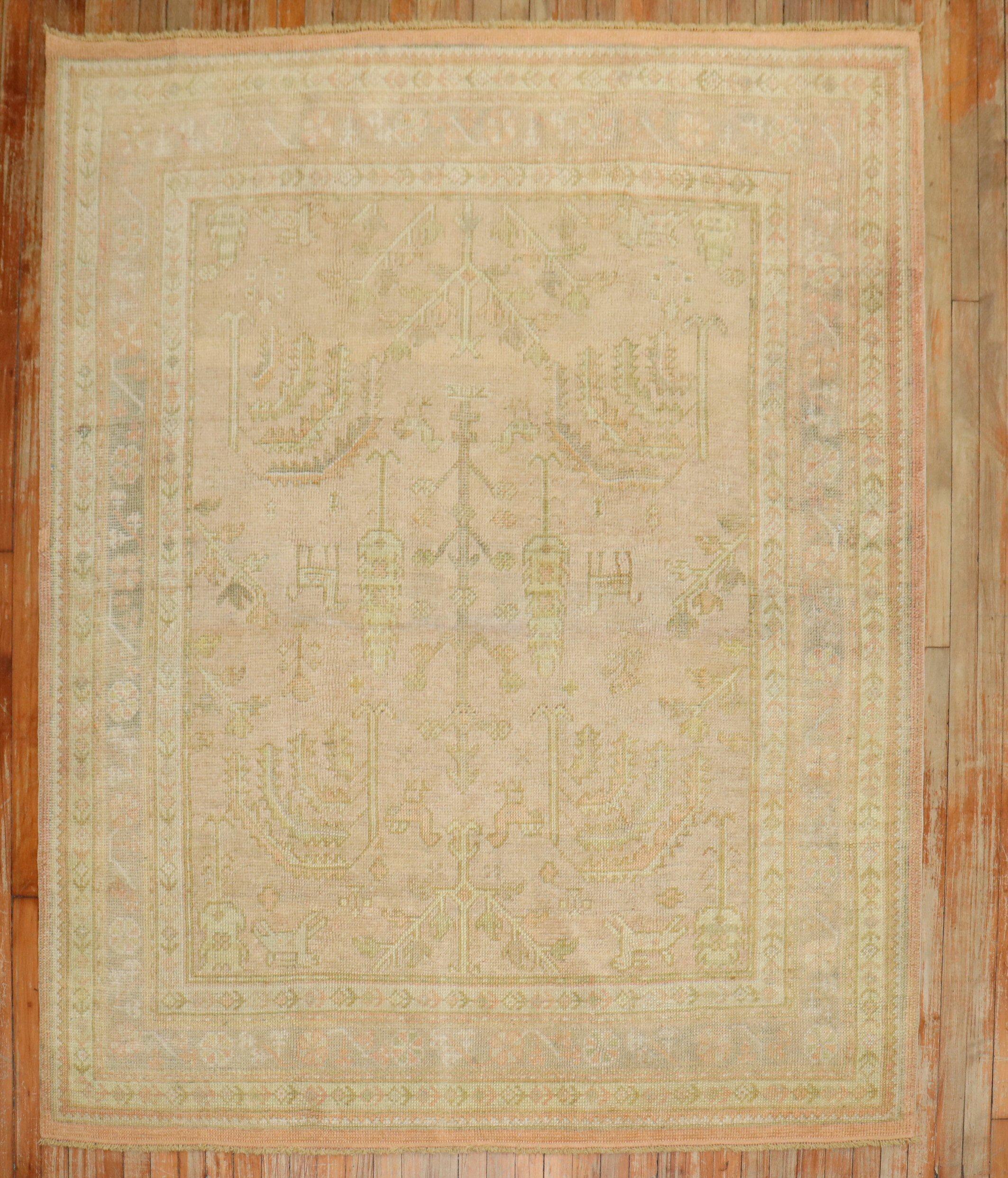 an early 20th-century square size antique Oushak rug with a willow tree pattern on a soft pink ground

Details
rug no.	j3818
size	5' 11