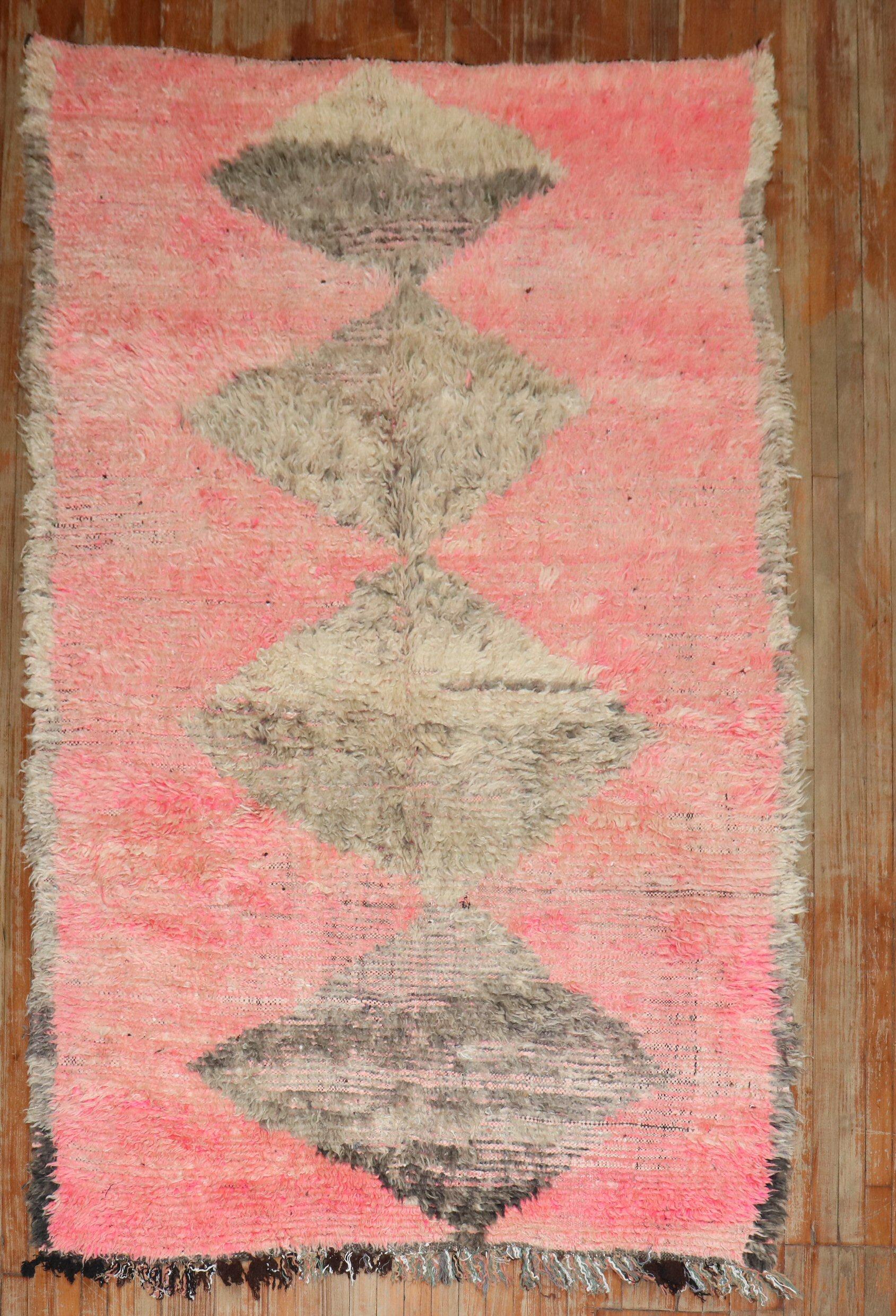 A Mid-20th century Moroccan Intermediate size rug in pinks and brown 

Measures: 5'4'' x 8'9''.
 
 