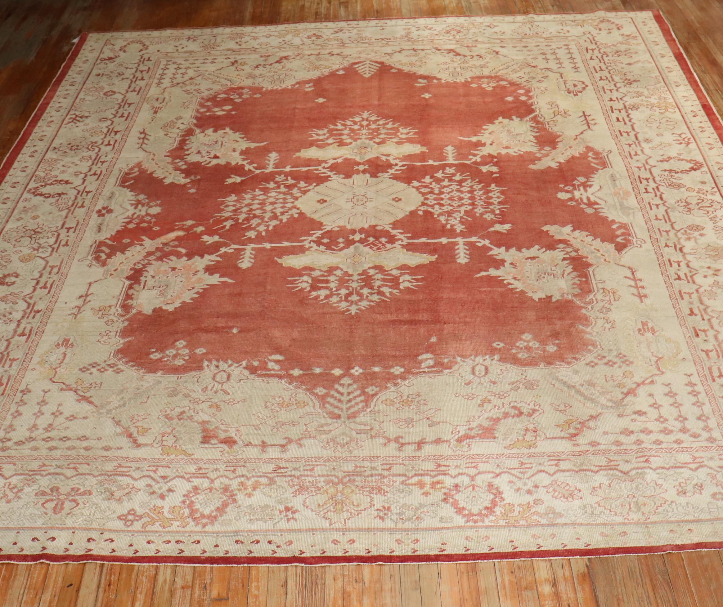 An early 20th-century antique Turkish Oushak rug

circa 1920, measures: 12'4” x 14'1”.