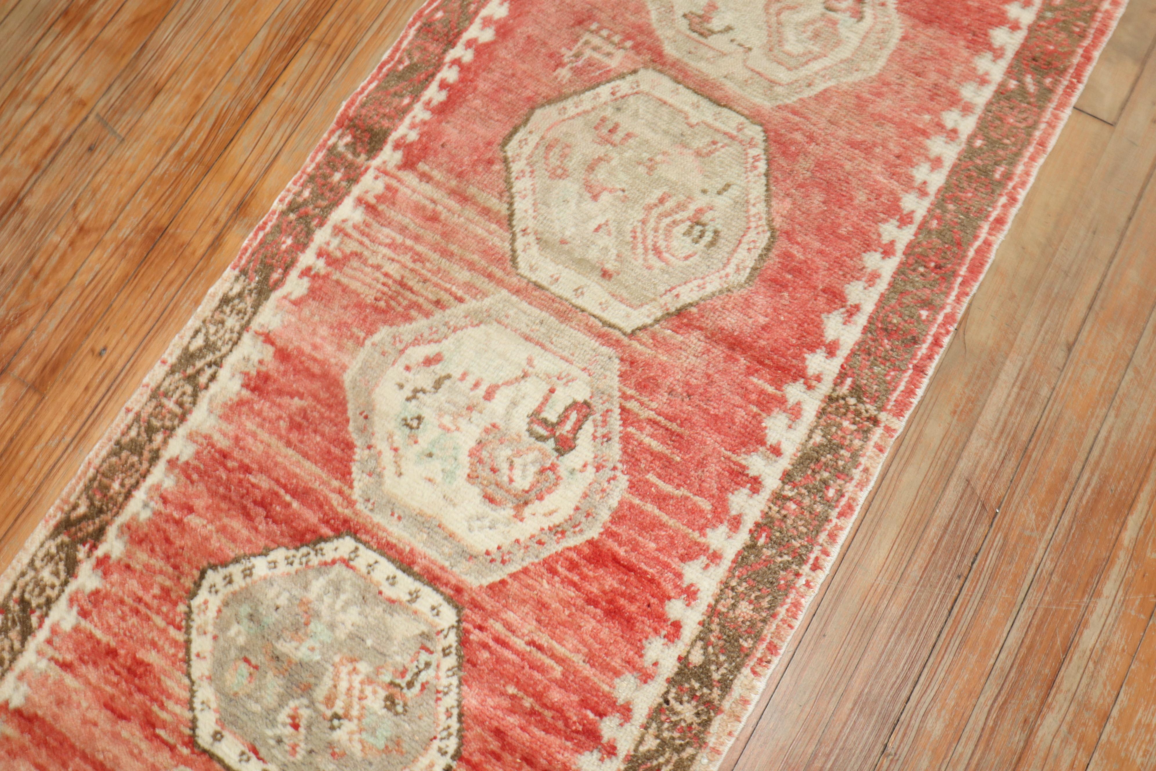 A mid 20th Century narrow and small red turkish runner

Details
rug no.	r5903
size	2' 4