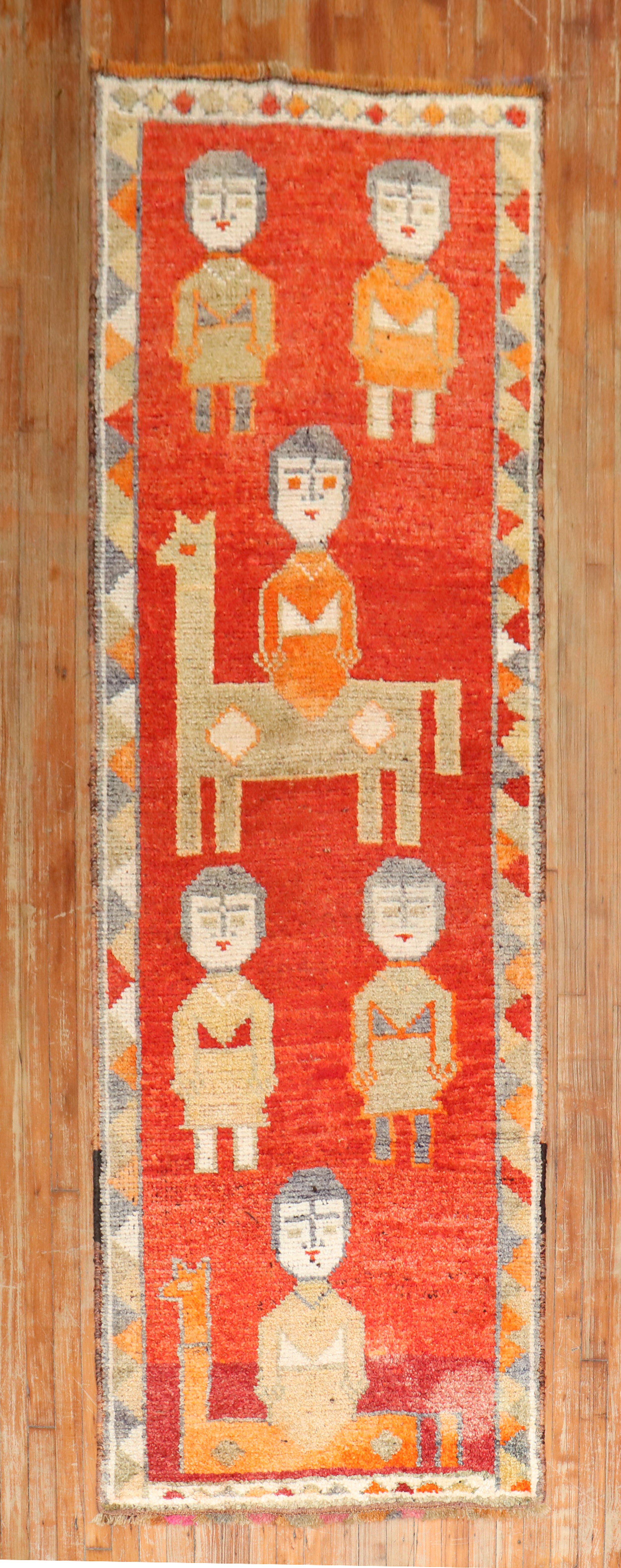 A decorative one of a kind colorful mid 20th-century Turkish runner featuring 6 humans and 2 animals

Measures: 3'1'' x 9'4''