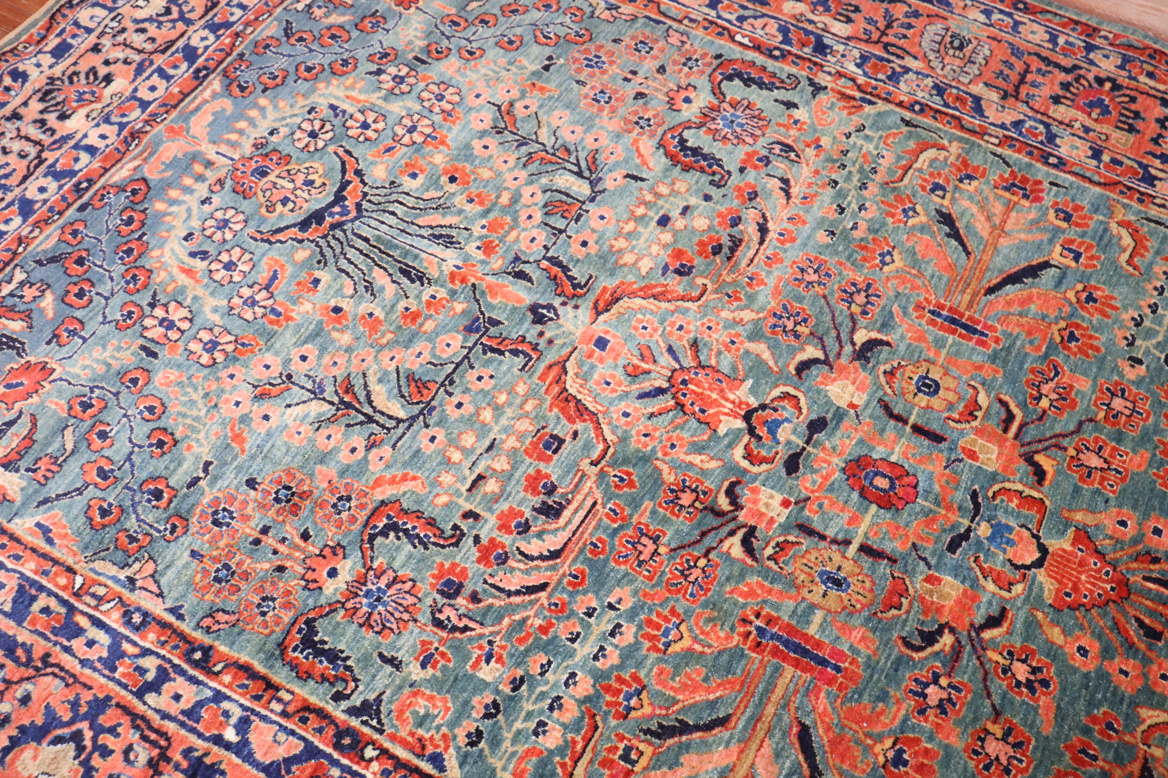 an early 20th Century Persian Sarouk Intermediate Rug with a rich emerald green field

Details
rug no.	j3696

size	5' 11