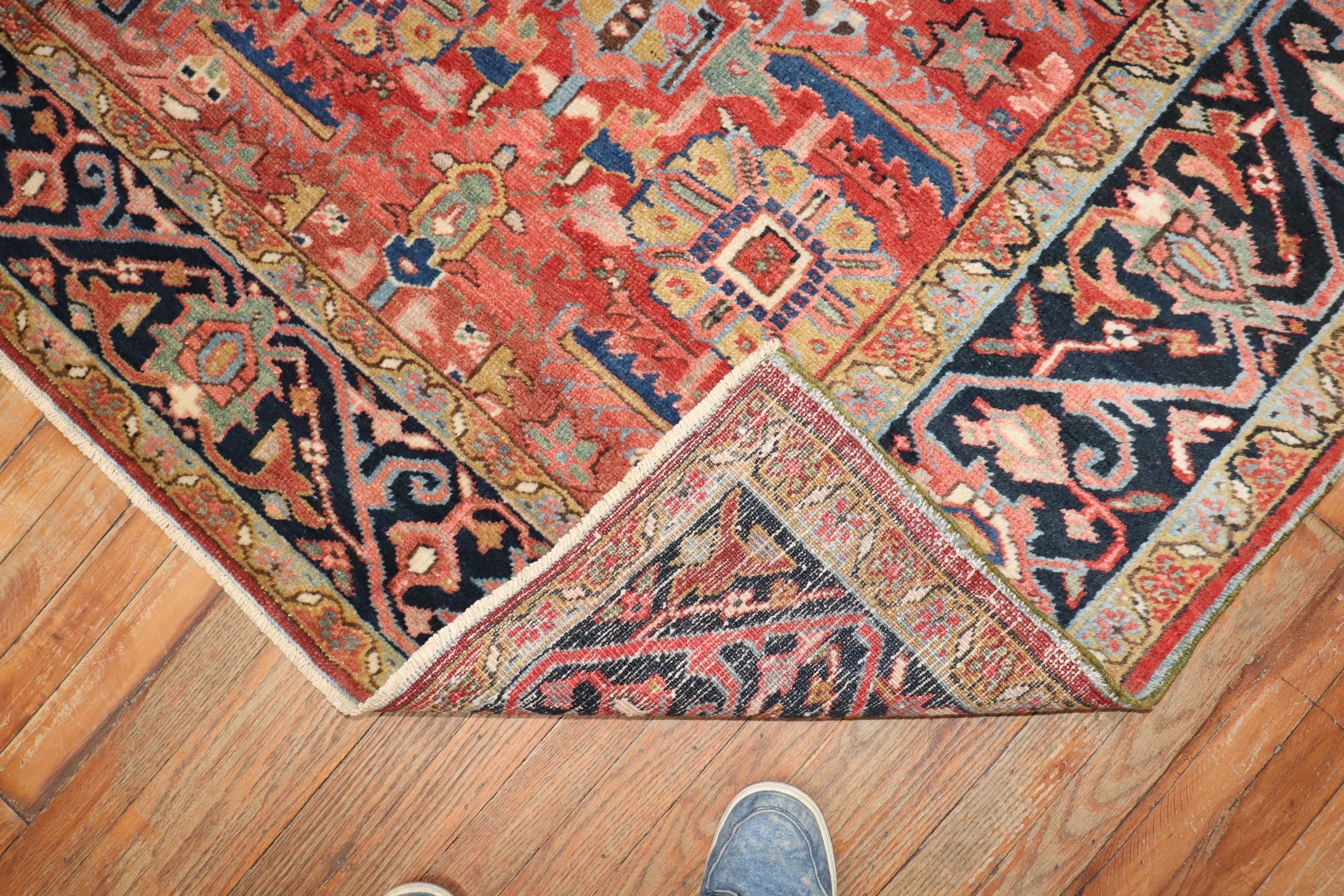 An early 20th-century Persian Heriz room size rug

Measures: 7'8'' x 11'2''.