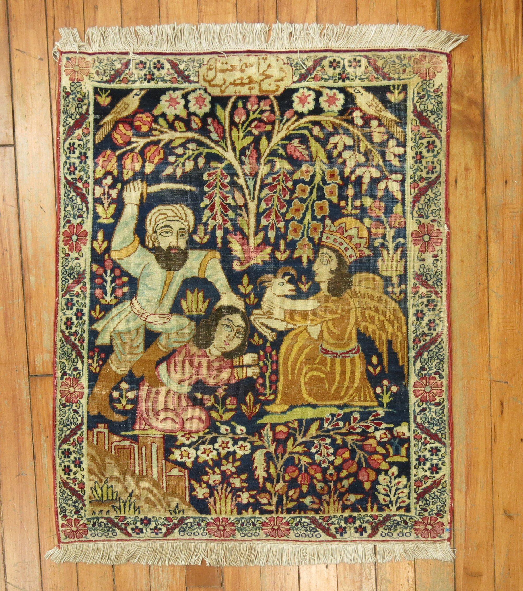 a late 19th century lavar kerman rug depicting God sending and angel to try to save a Father killing his only child with a sheep

Details
rug no.	j1321
size	2' x 2' 4