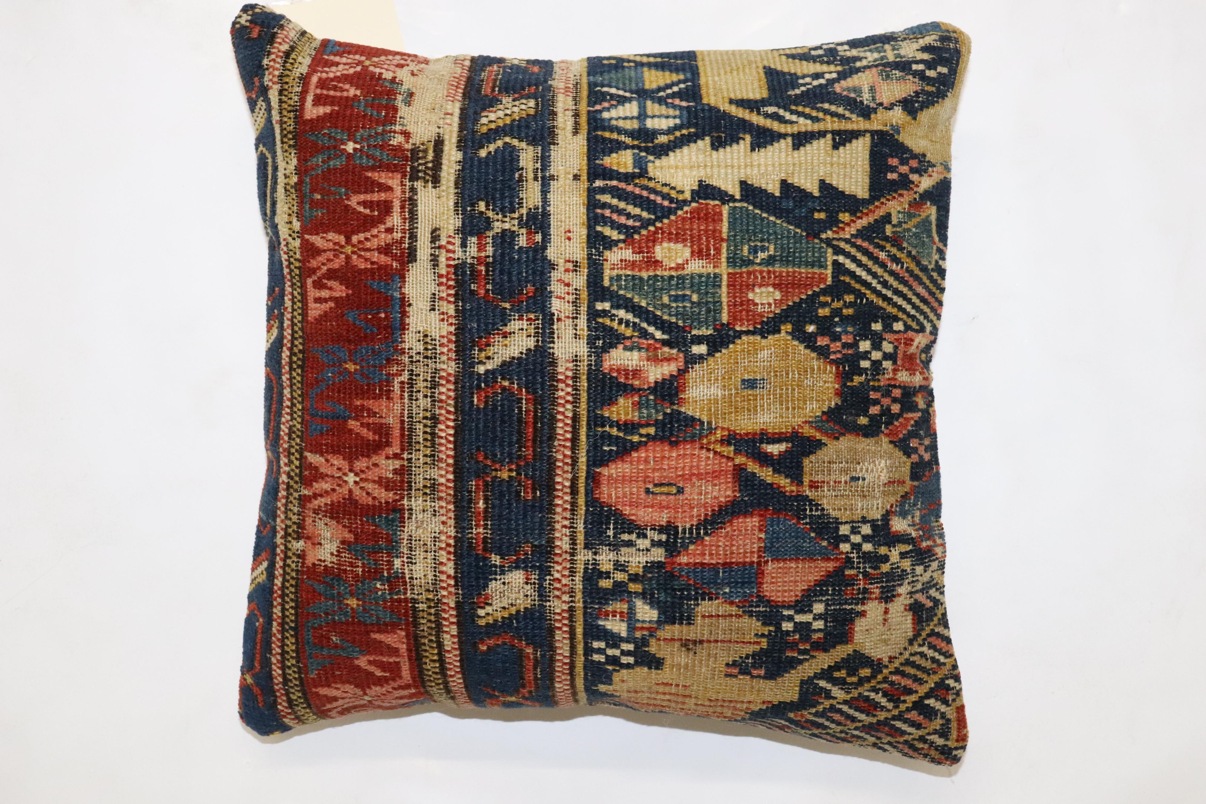 Pillow made from a 19th-century Caucasian rug with cotton back and zipper closure included.

Measures: 15'' x 15''.