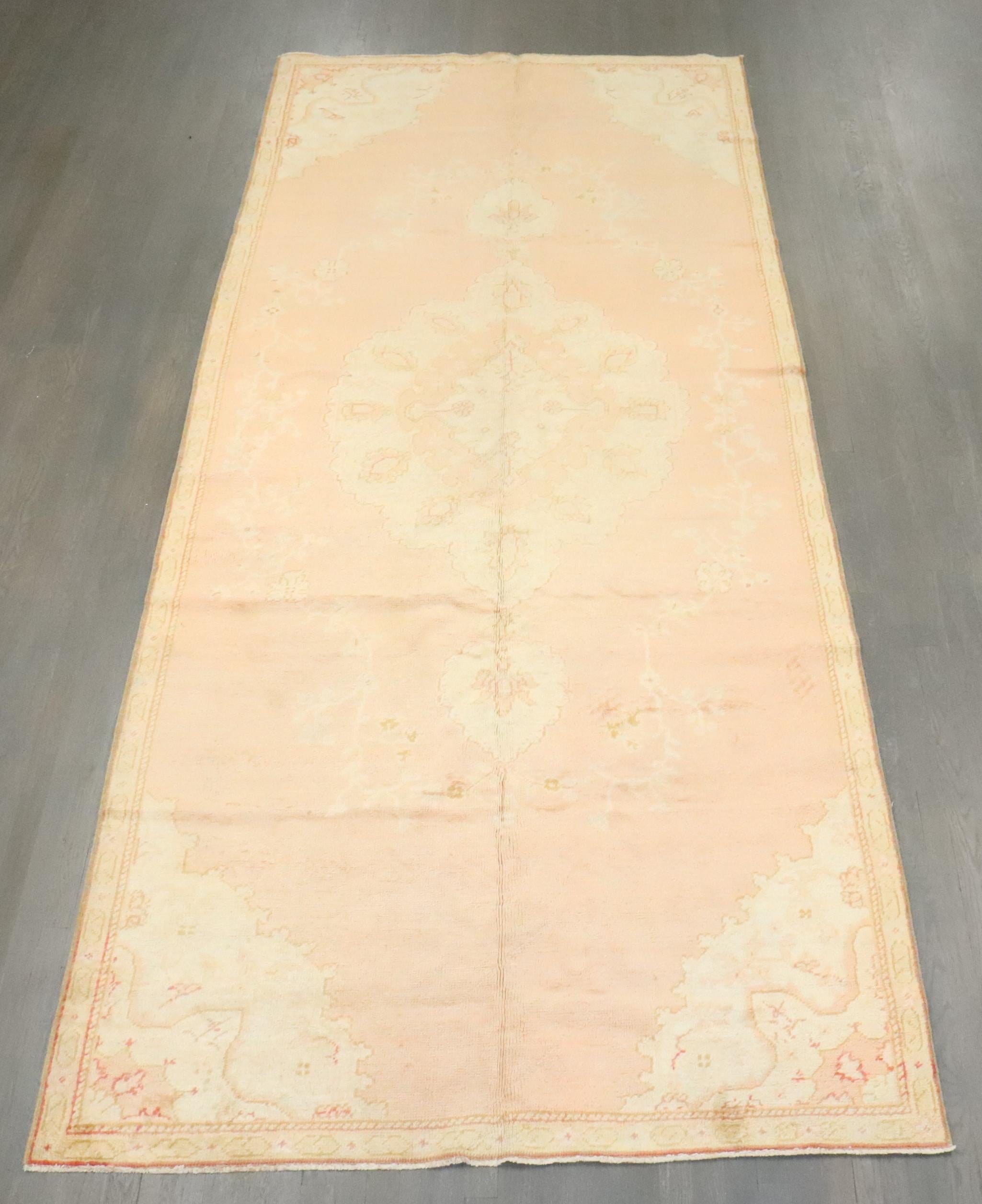 A mid-20th century Turkish Oushak gallery size rug 

Measures: 5'6'' x 13'2''.