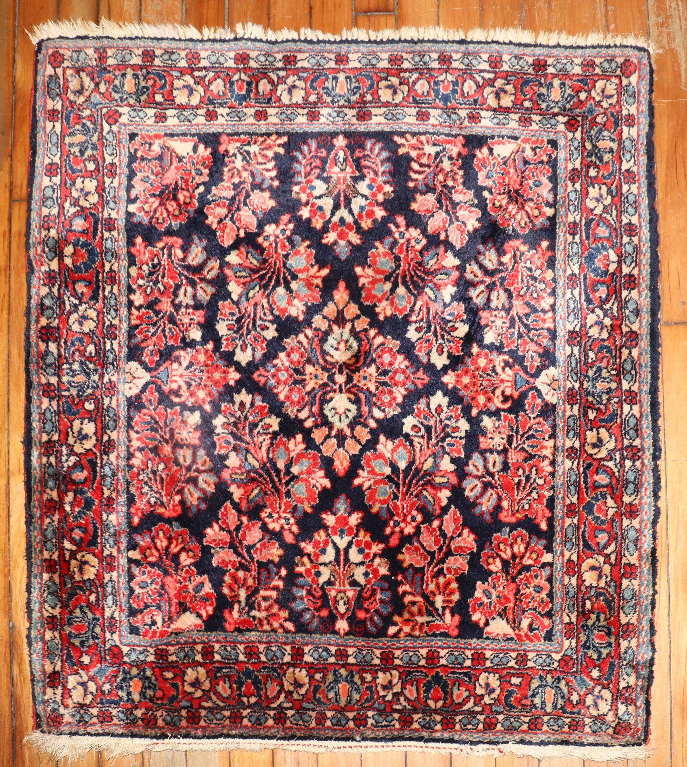 An authentic mid 20th-century Sarouk carpet with traditional in rare square size on a navy field

Measures: 2'9
