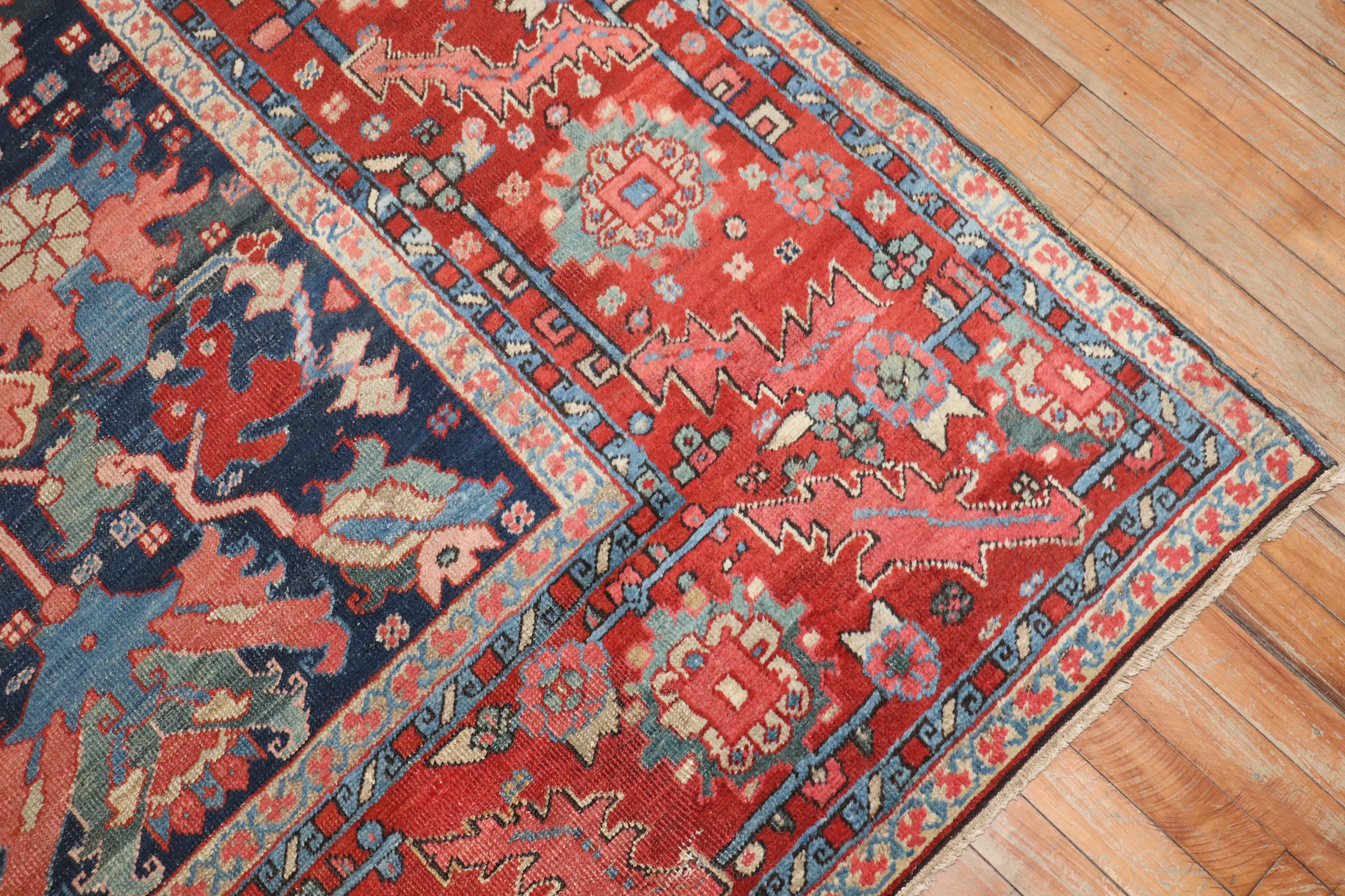 A captivating late 19th century jewel toned Persian Serapi rug.

9'11'' x 12'8''