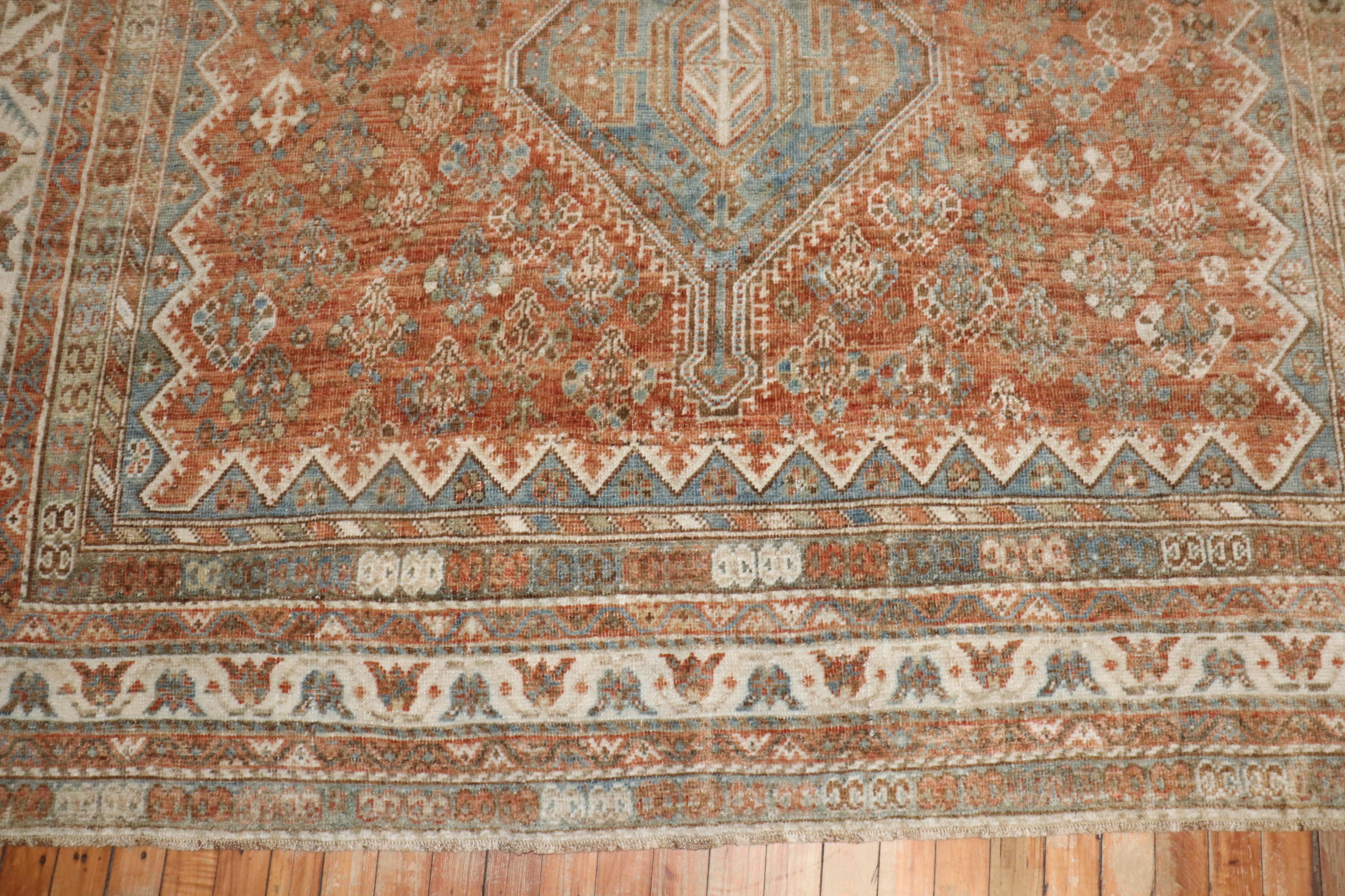 An early 20th century Persian Shiraz small room size tribal rug in earth tones

circa 1920

Measures: 7'5