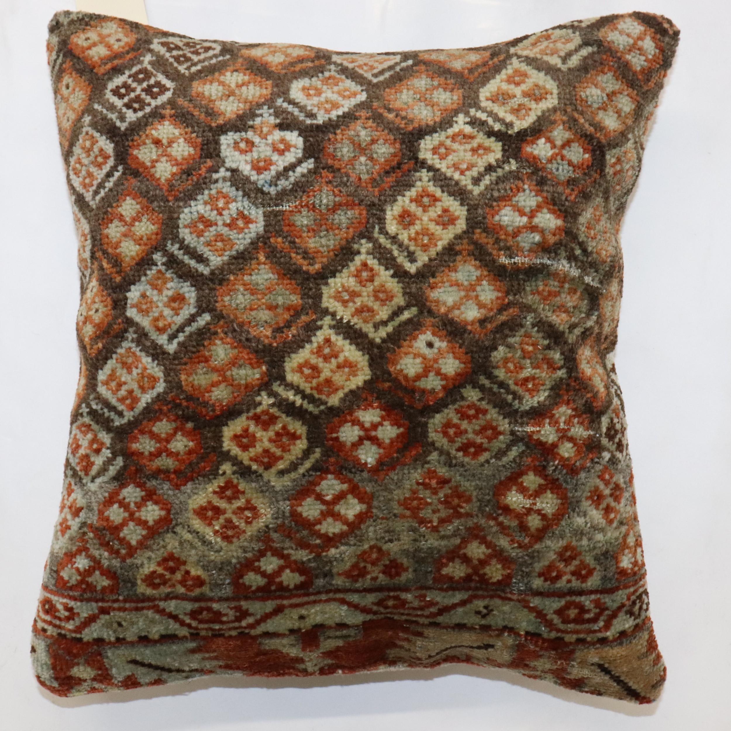 Pillow made from an early 20th-century Antique Persian Kurd Rug . Zipper closure and poly-fill provided.

Measures: 16'' x 17''