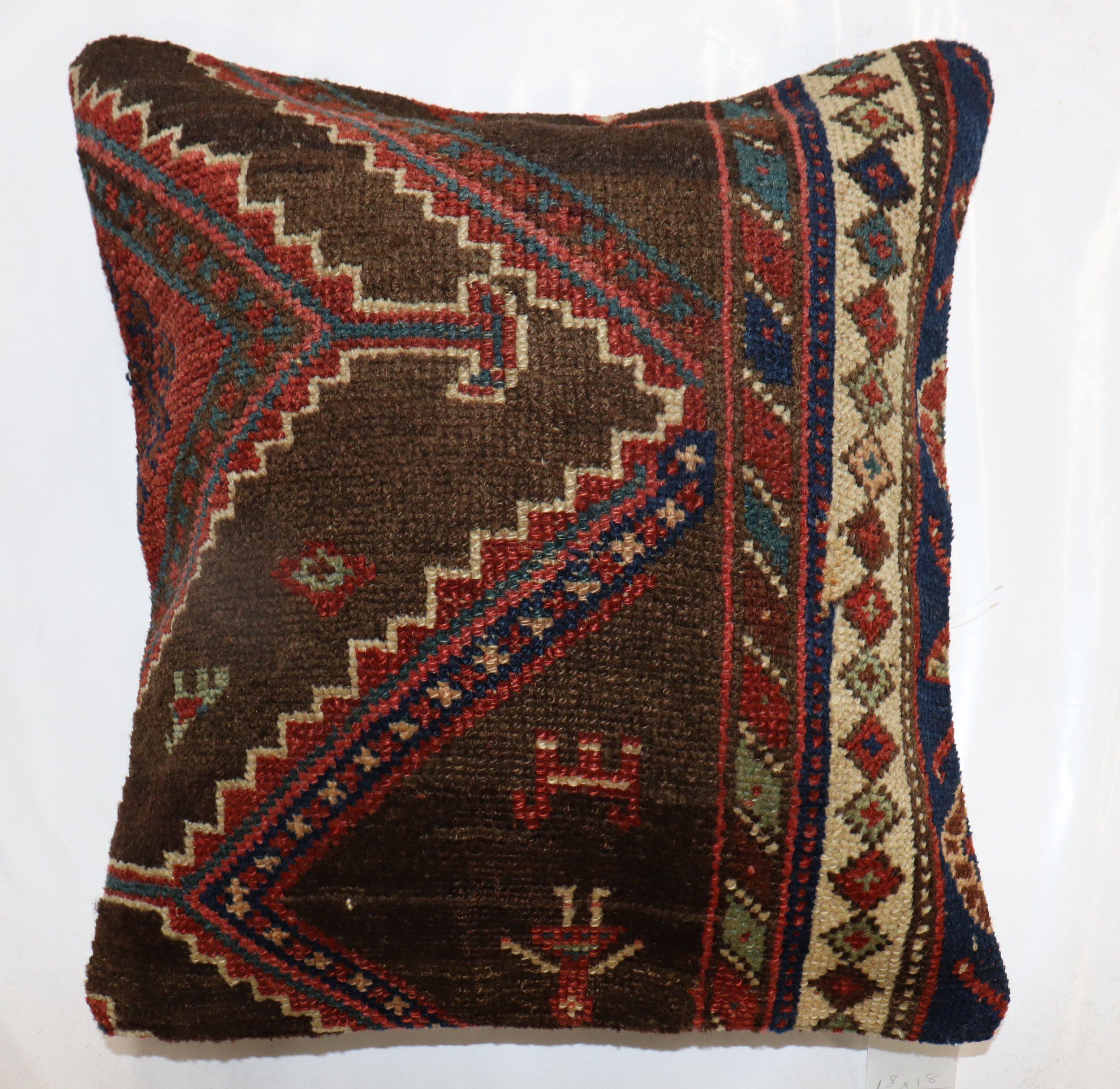 Pillow made from an early 20th-century Antique Persian Kurd Rug . Zipper closure and poly-fill provided.

Measures: 20'' x 20''