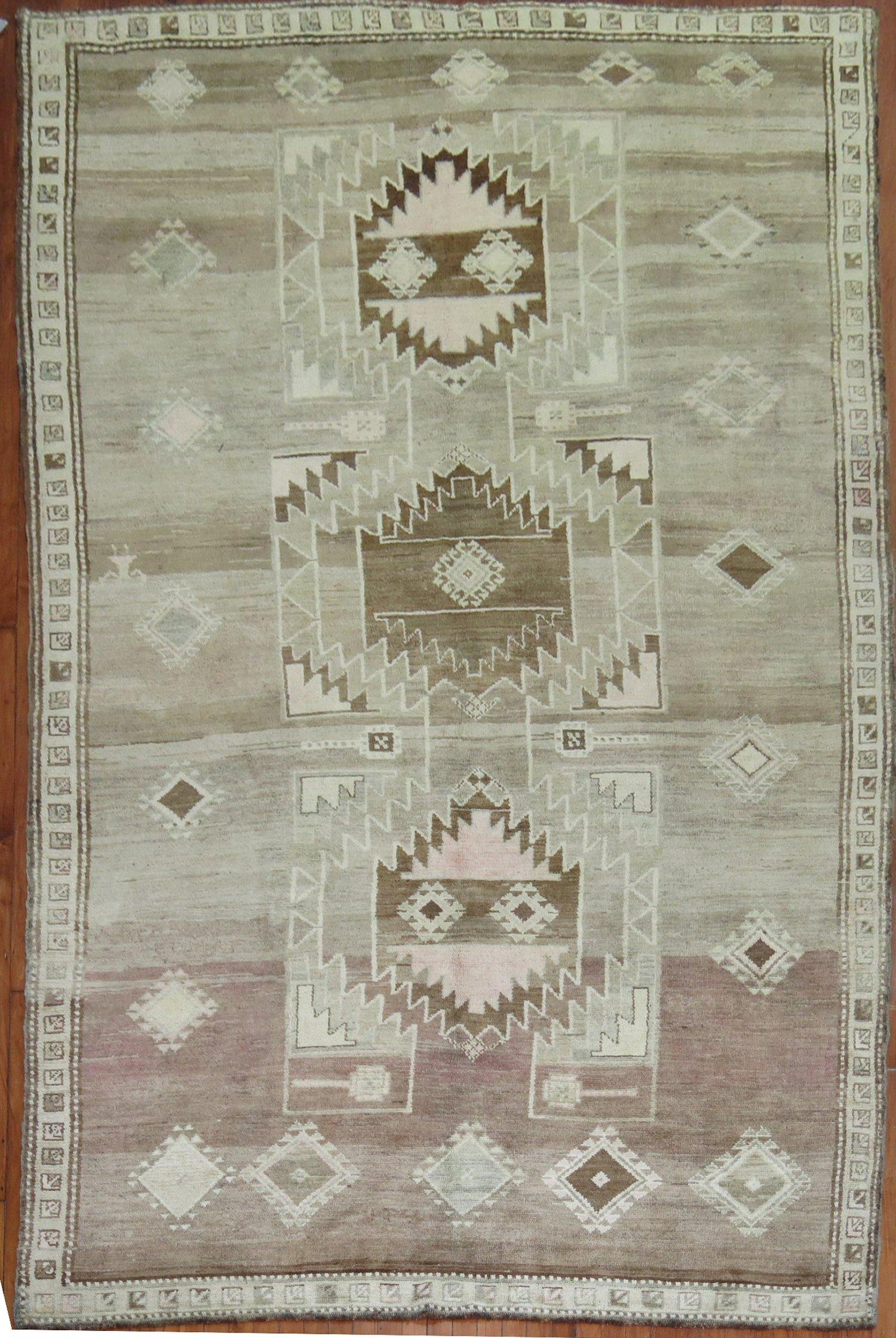 A Turkish Kars tribal room size rug from the middle of the 20th century

6'9'' x 12'2''

Kars is a village located in Northeast of Turkey. The weavers in this area tend to make long runners and long odd size gallery rugs, with large medallions often