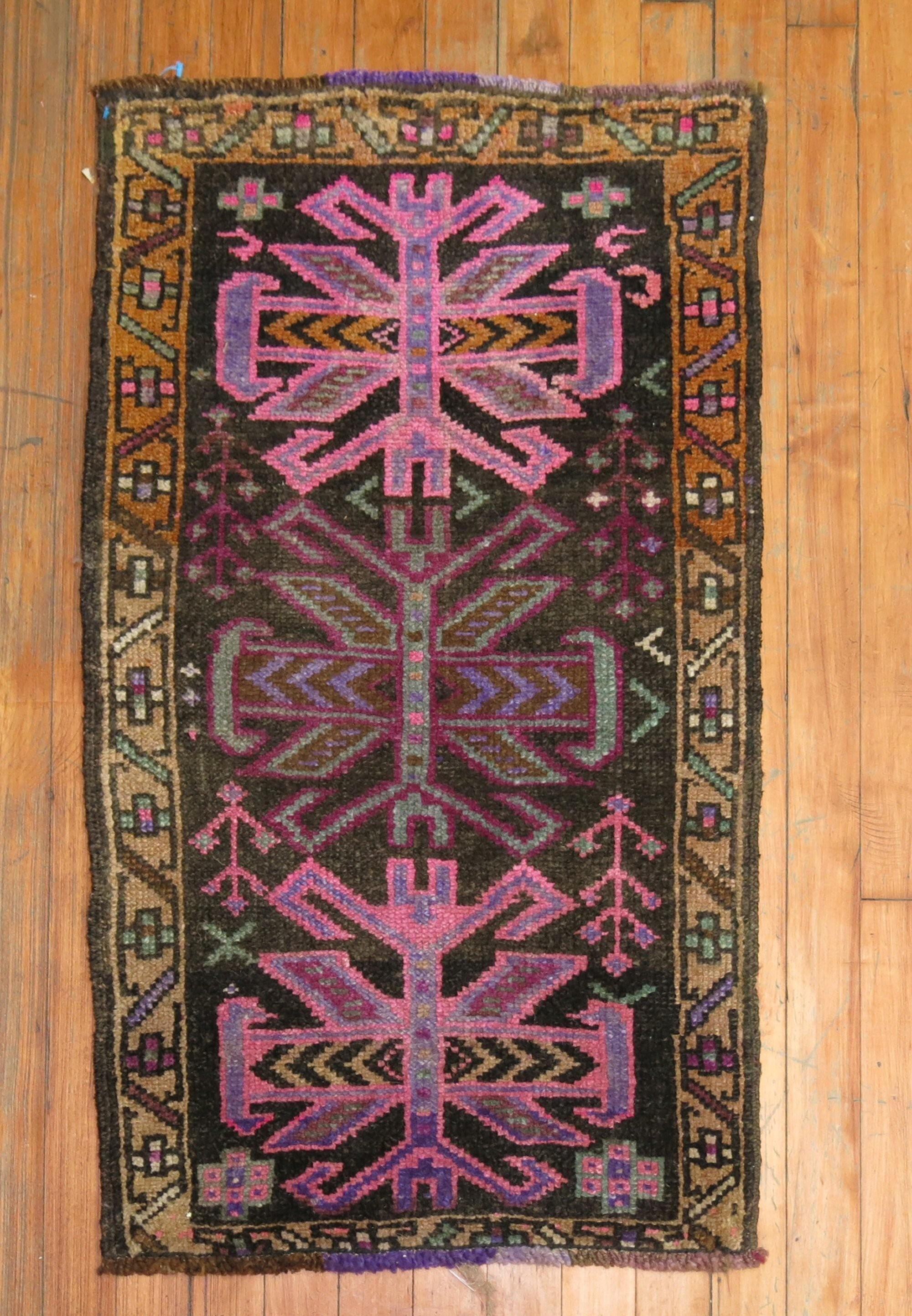 One of a kind vintage Turkish rug in brown pink and purple

1'9'' x 2'10''.