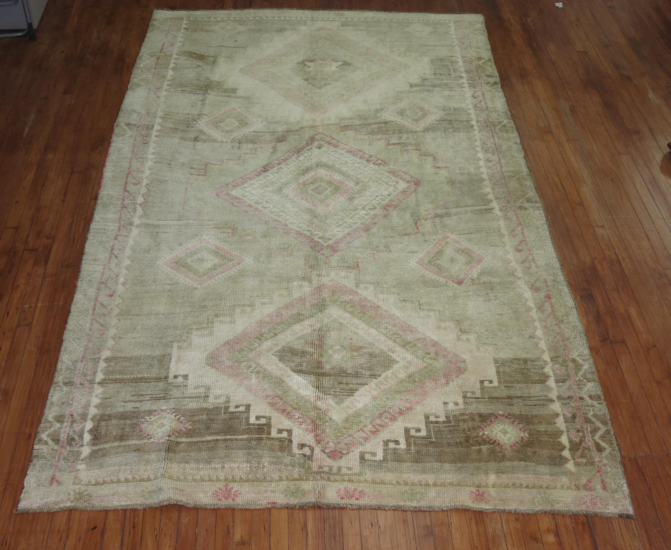 mid-20th century Turkish Geometric rug featuring pops of pink with a neutral color base

6'8'' x 11'2''

