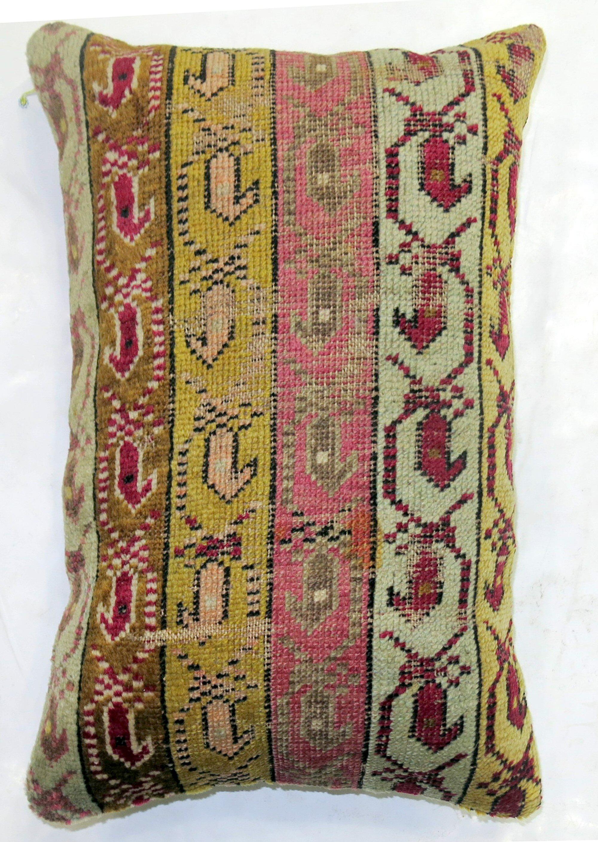Pillow made from an early 20th-century Turkish Ghiordes rug.

14'' x 21''