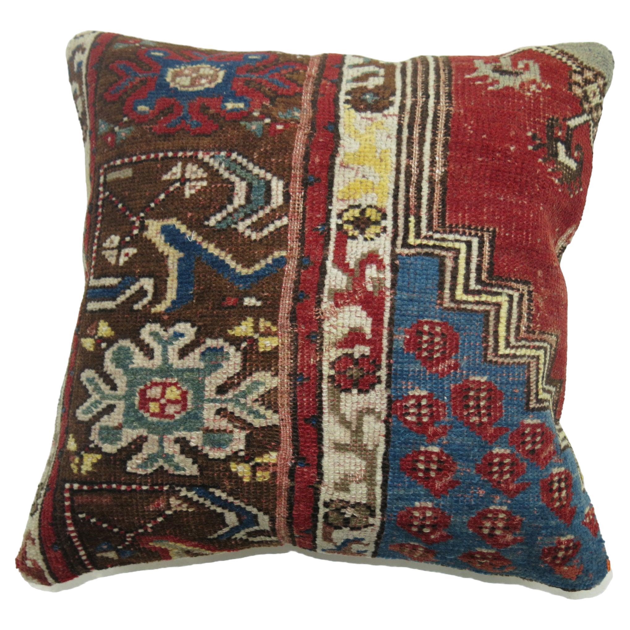 Pillow made from a vintage Turkish rug in reds and blues

17'' x 18''