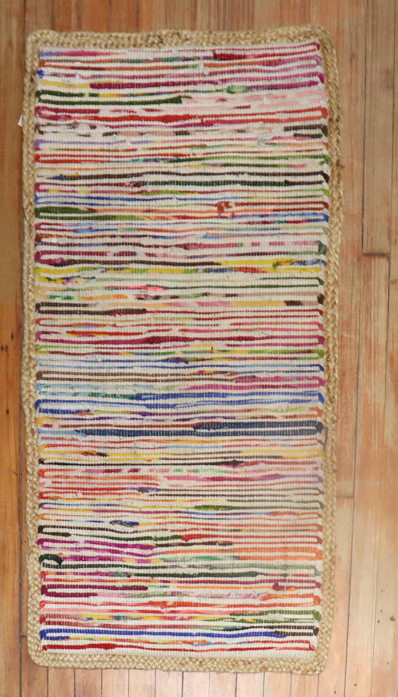 a mini-size American Rag rug from the late20th century

Measures: 2'1'' x 3'9''.
