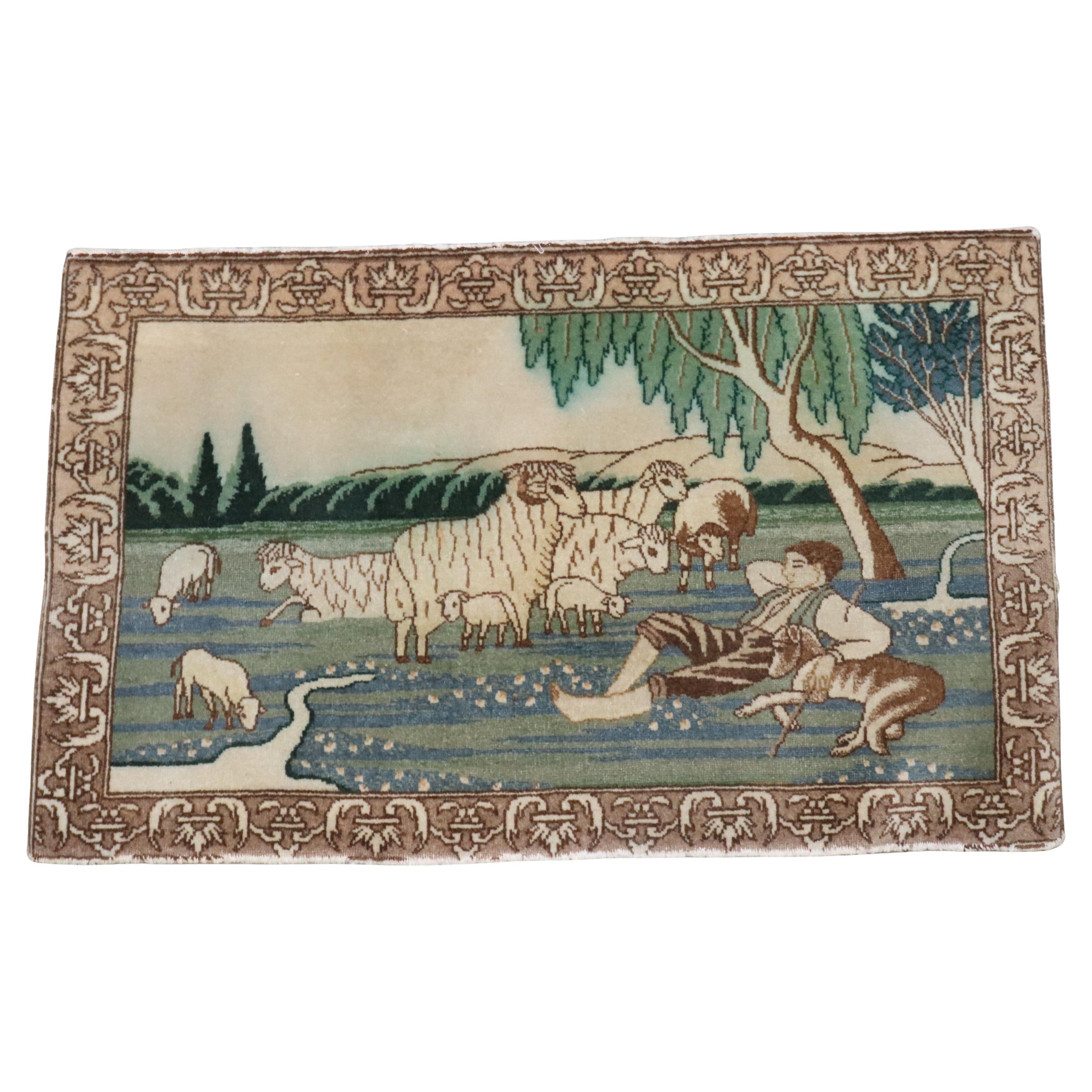 A mid 20th century Persian Tabriz small rug with a man lying on the ground surrounded by a flock of sheep

Details
rug no.	j4038
size	1' 10