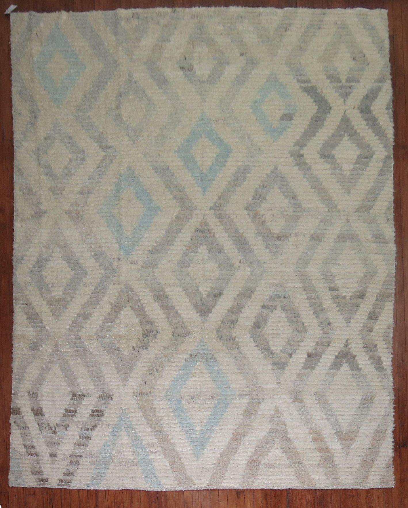 Contemporary Old wool Turkish Tulu in faded creams, gray and light blues.

Measures: 8'3'' x 11'6''.