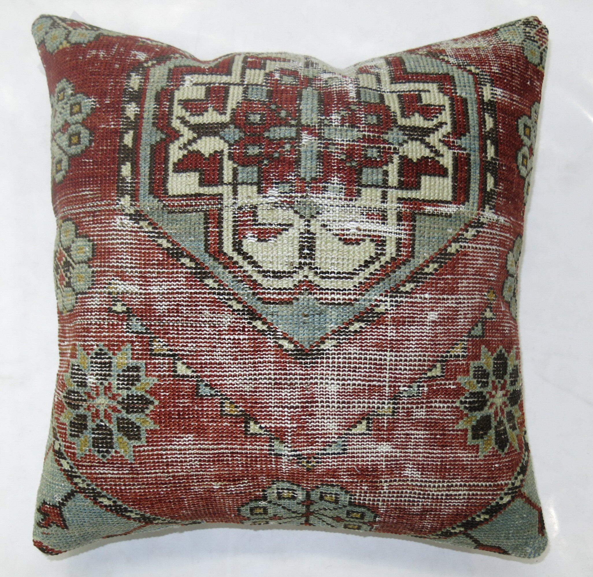 Pillow made from a 19th century distressed Caucasian rug.

16'' x 16''