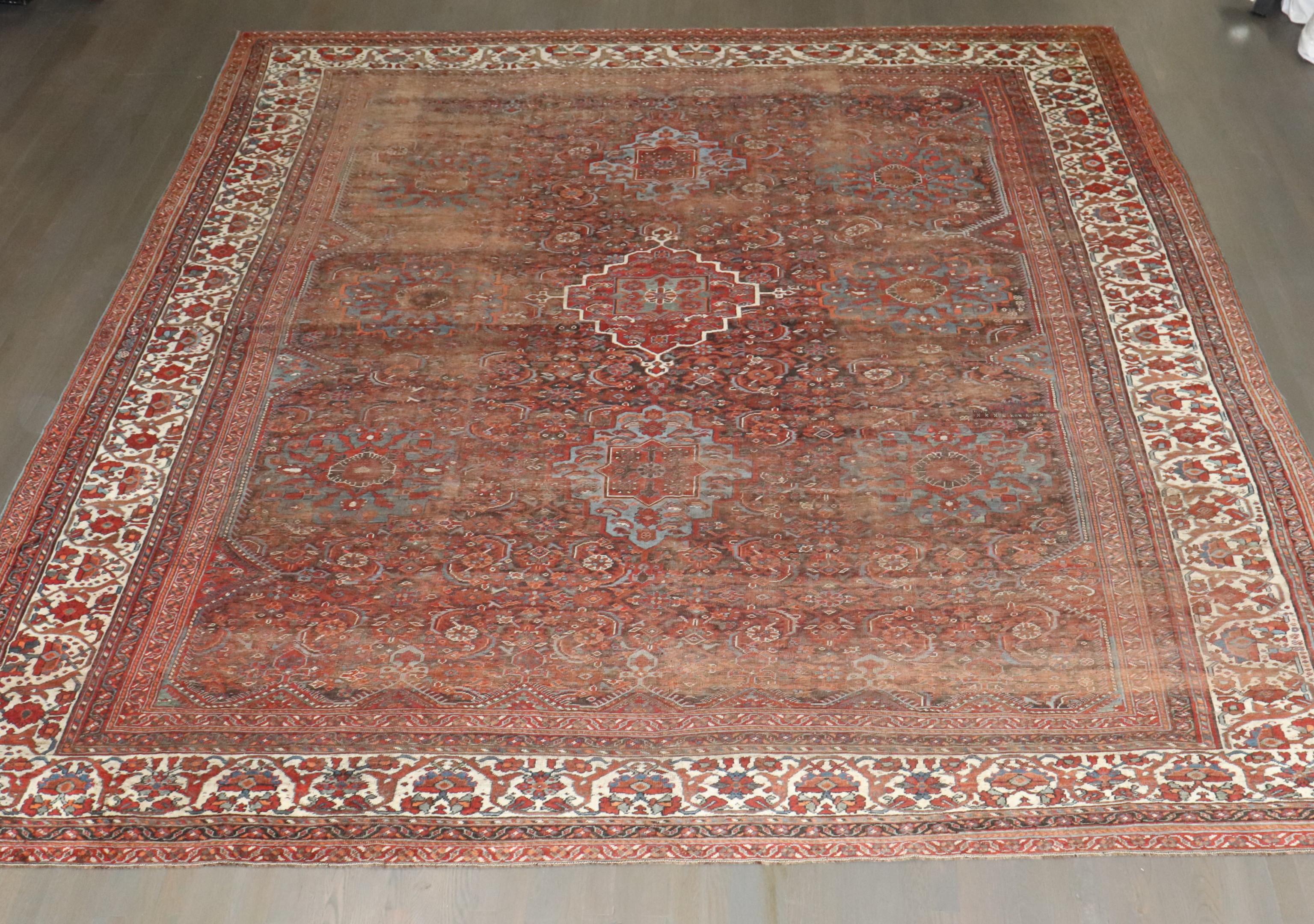 Zabihi Collection Worn Persian Large SquareTribal Shiraz Rug In Fair Condition For Sale In New York, NY