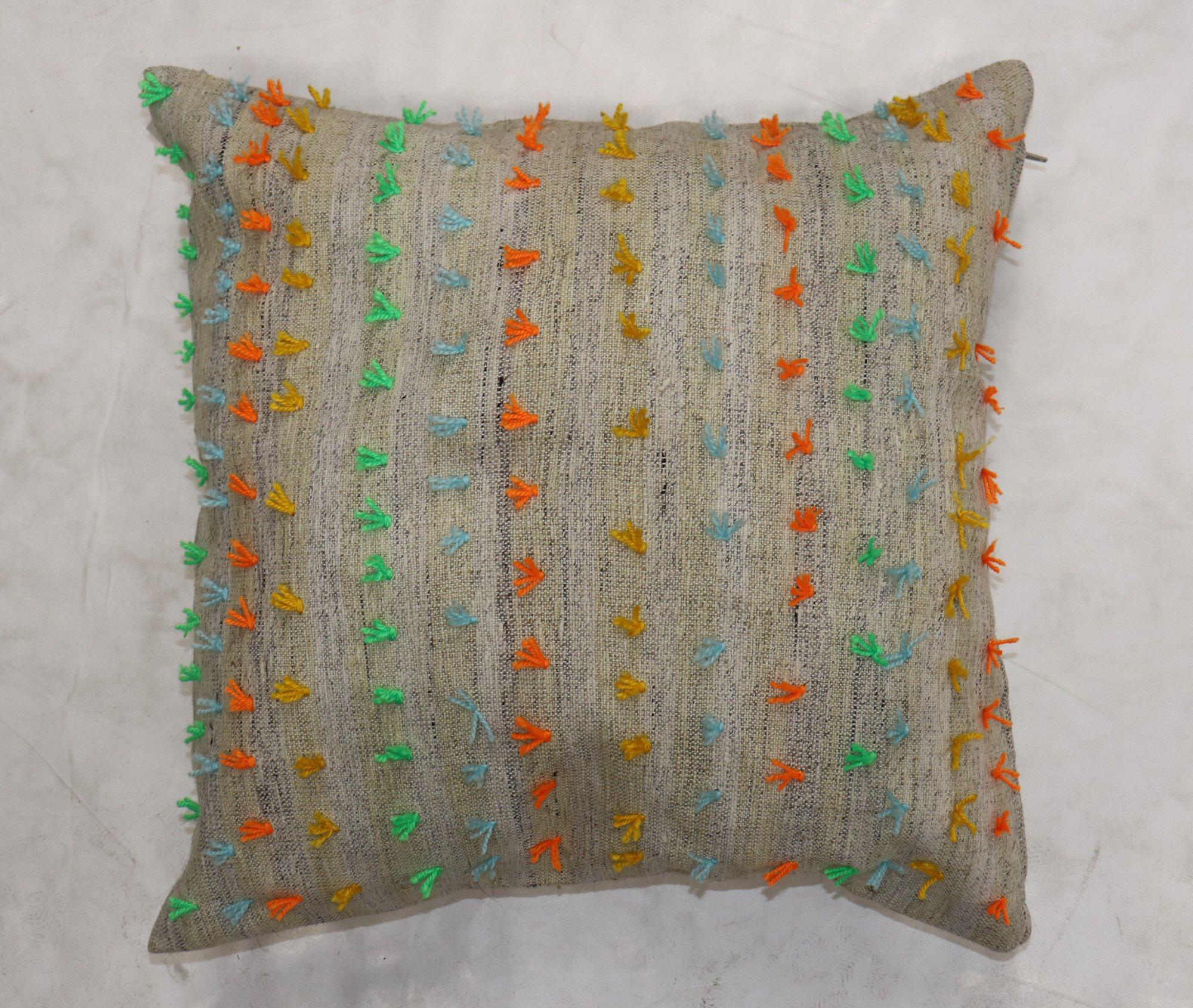 Pillow made from a vintage Turkish Kilim with colorful pops of wool stitched on giving it a bohemian vibe. Zipper closure and foam insert provided.


Measures: 23